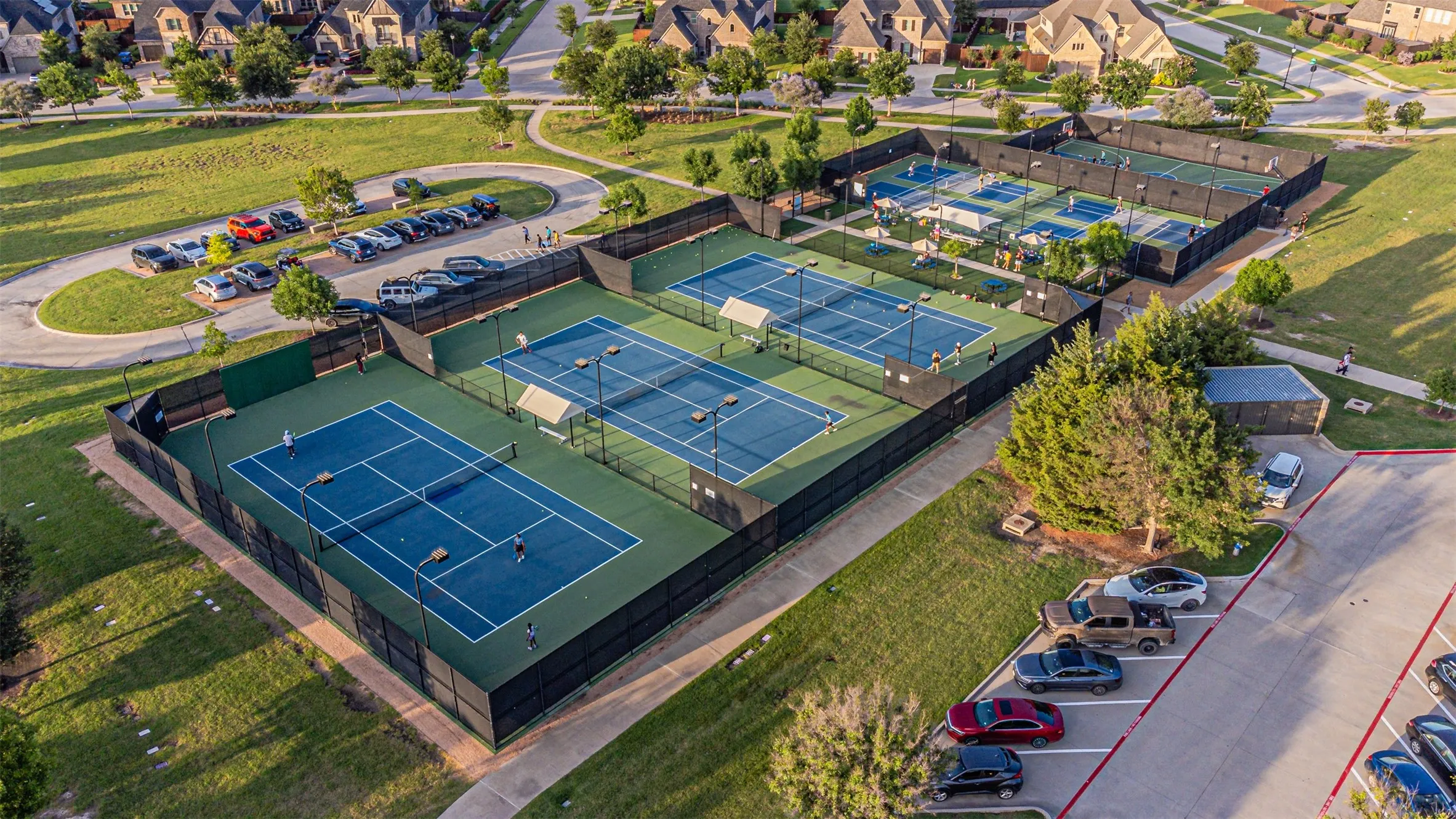 Multiple sports courts featuring blue and green surfacing