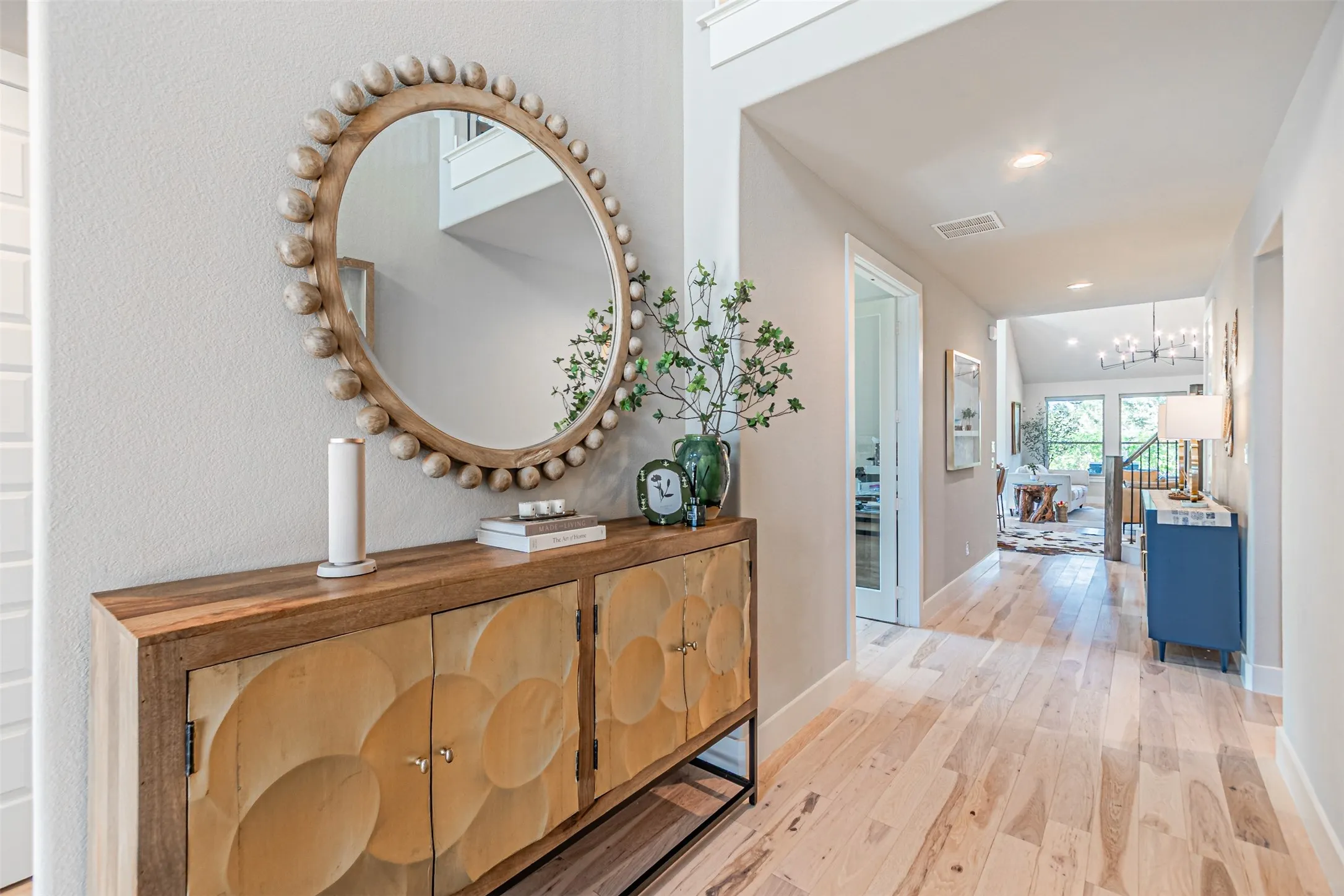 Entryway featuring light wood-finish flooring, light gray wall paint, and recessed lighting