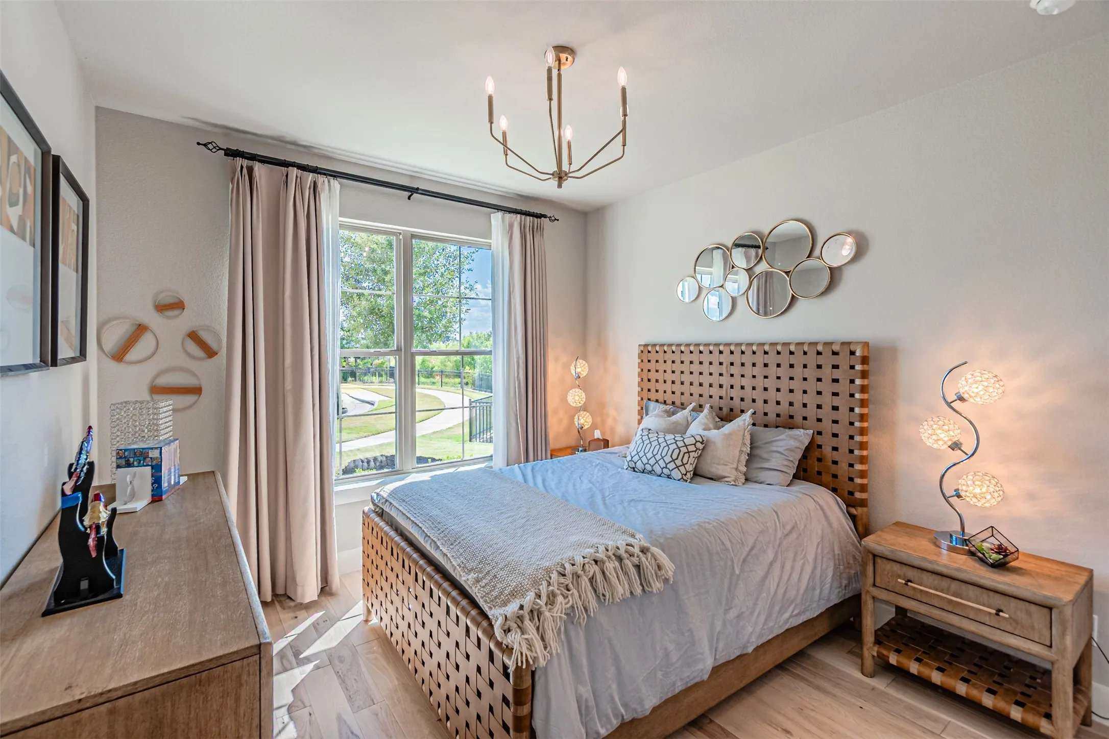 Bright room featuring a large double-hung window with a verdant outdoor landscape