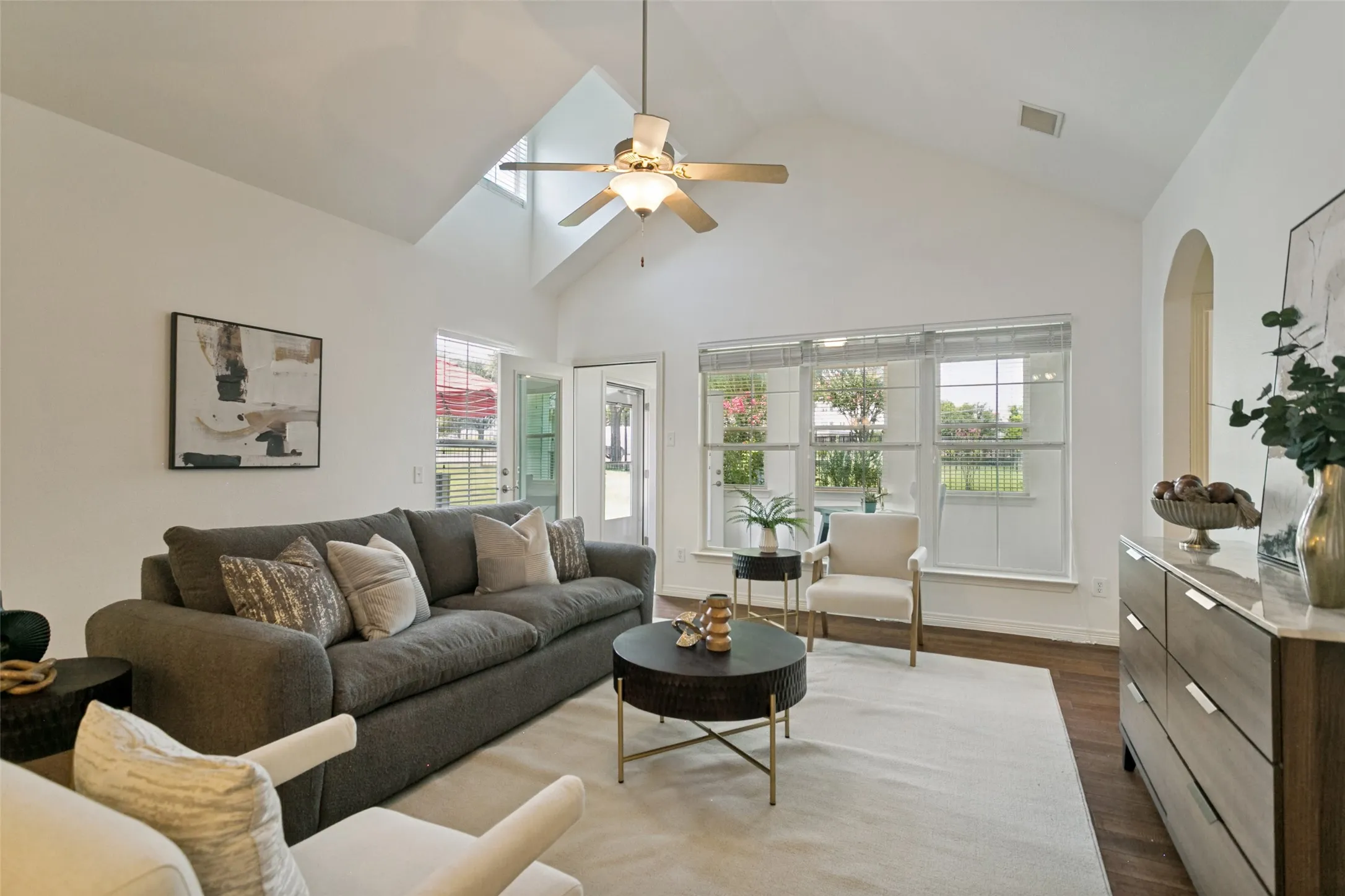 Another view of the living room overlooking the bright sunroom, with access to the patio and backyard through the sunroom. Direct access to clubhouse and amenities from the backyard gate.