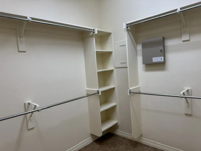 Another view of the expansive walk-in closet located in the primary bathroom.