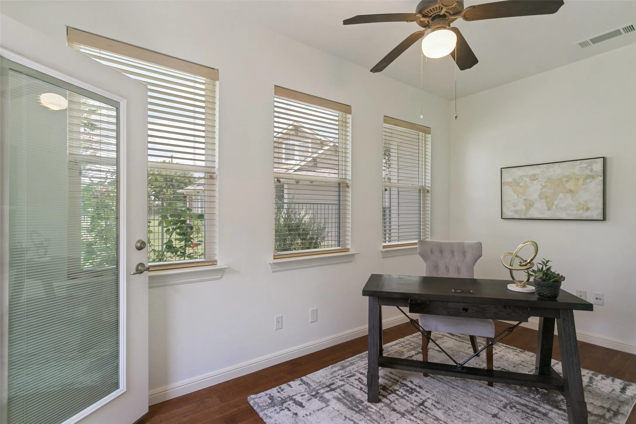 Bright and versatile sunroom off of the living room, offering a flexible space perfect for a craft room, exercise area, or quiet retreat. Direct access to the clubhouse and amenity center from your private backyard gate.