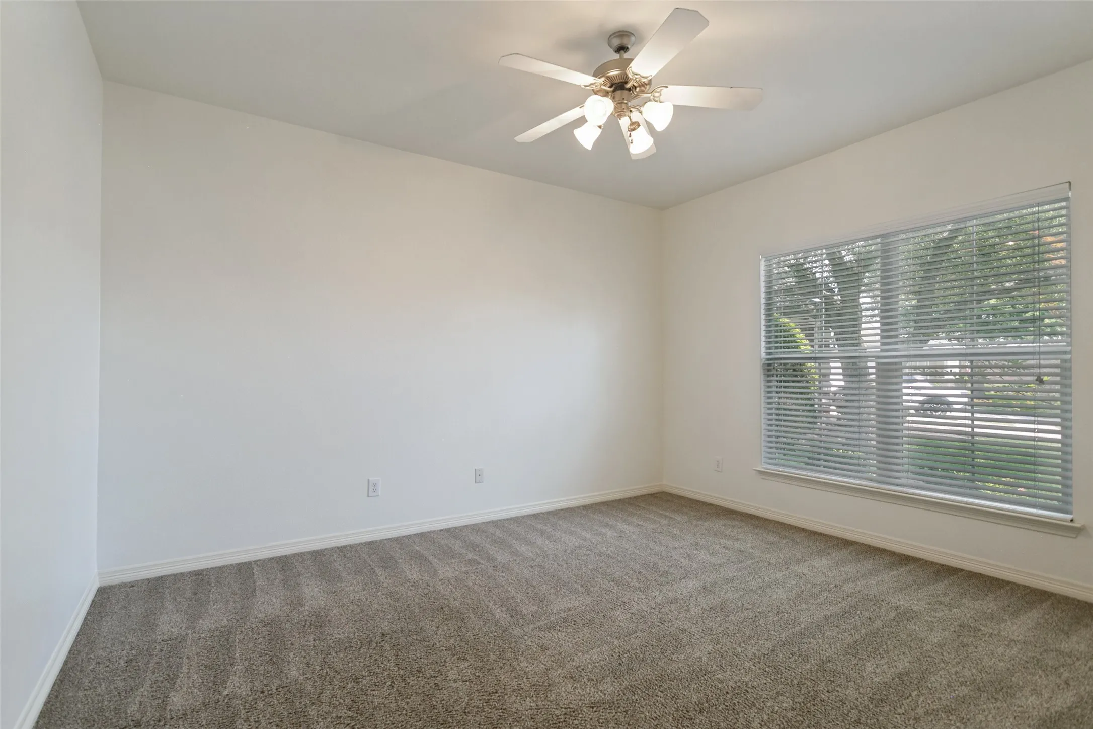Comfortable guest bedroom featuring a spacious walk-in closet and plenty of room for guests to relax and feel at home.