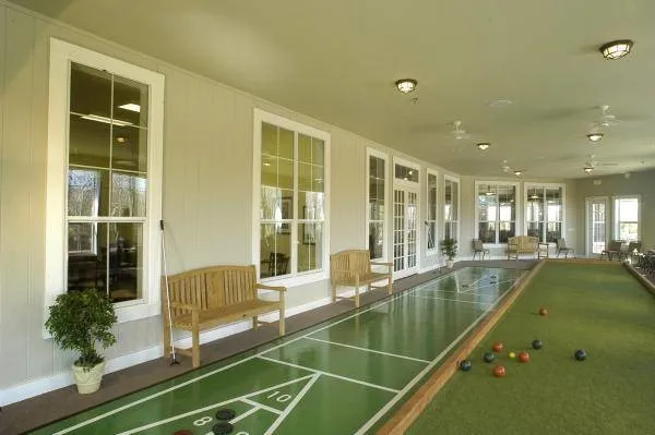 The bocce ball court provides a relaxed outdoor setting for friendly competition, socializing, and enjoying time with neighbors while embracing an active lifestyle.