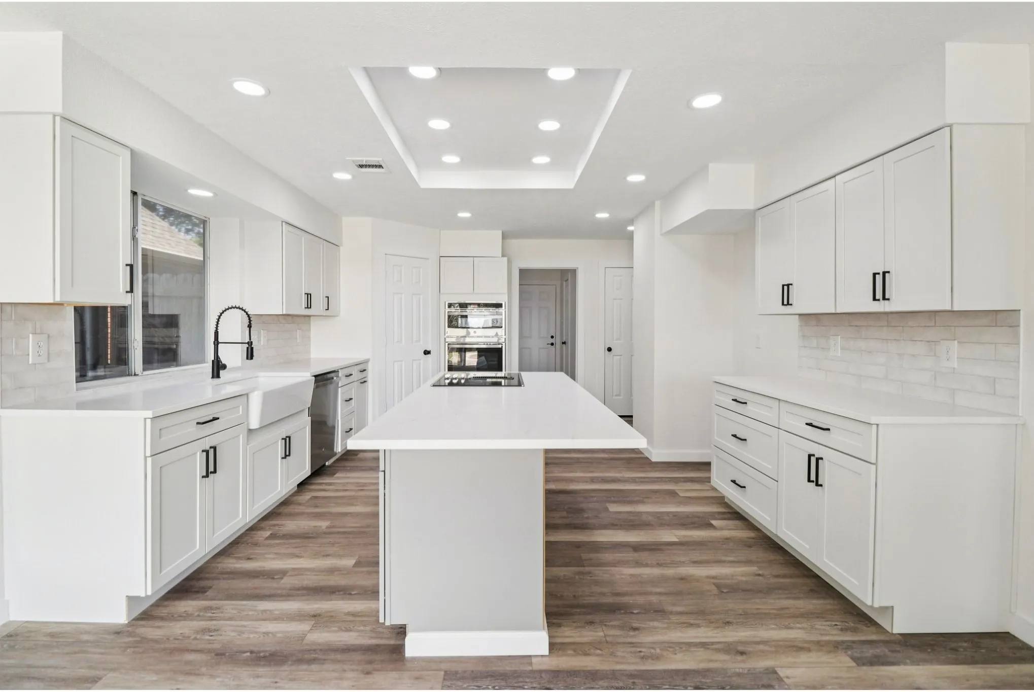 Completely remodeled kitchen with quartz countertops and oversized island.