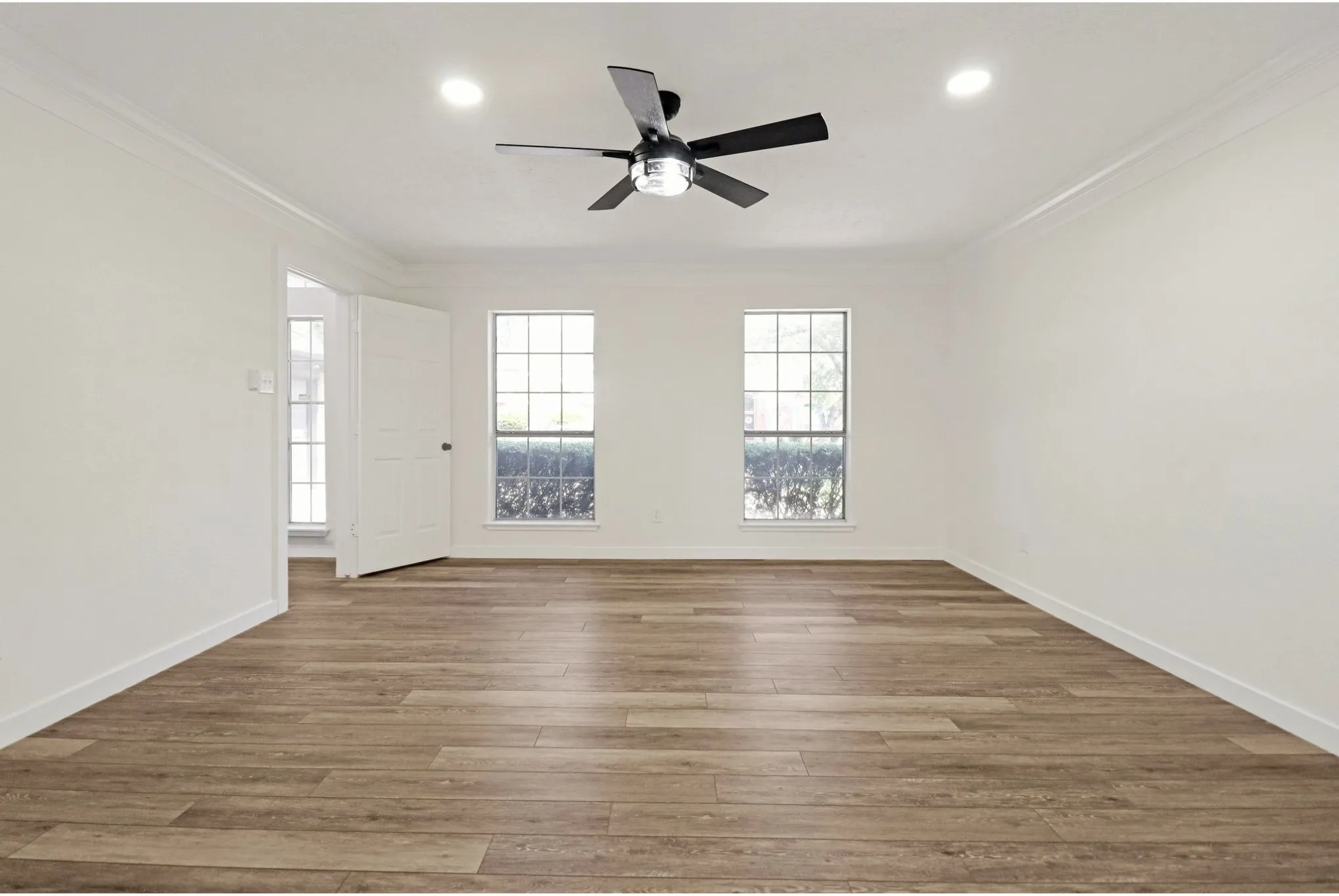 Private downstairs primary suite with generous space and natural light.