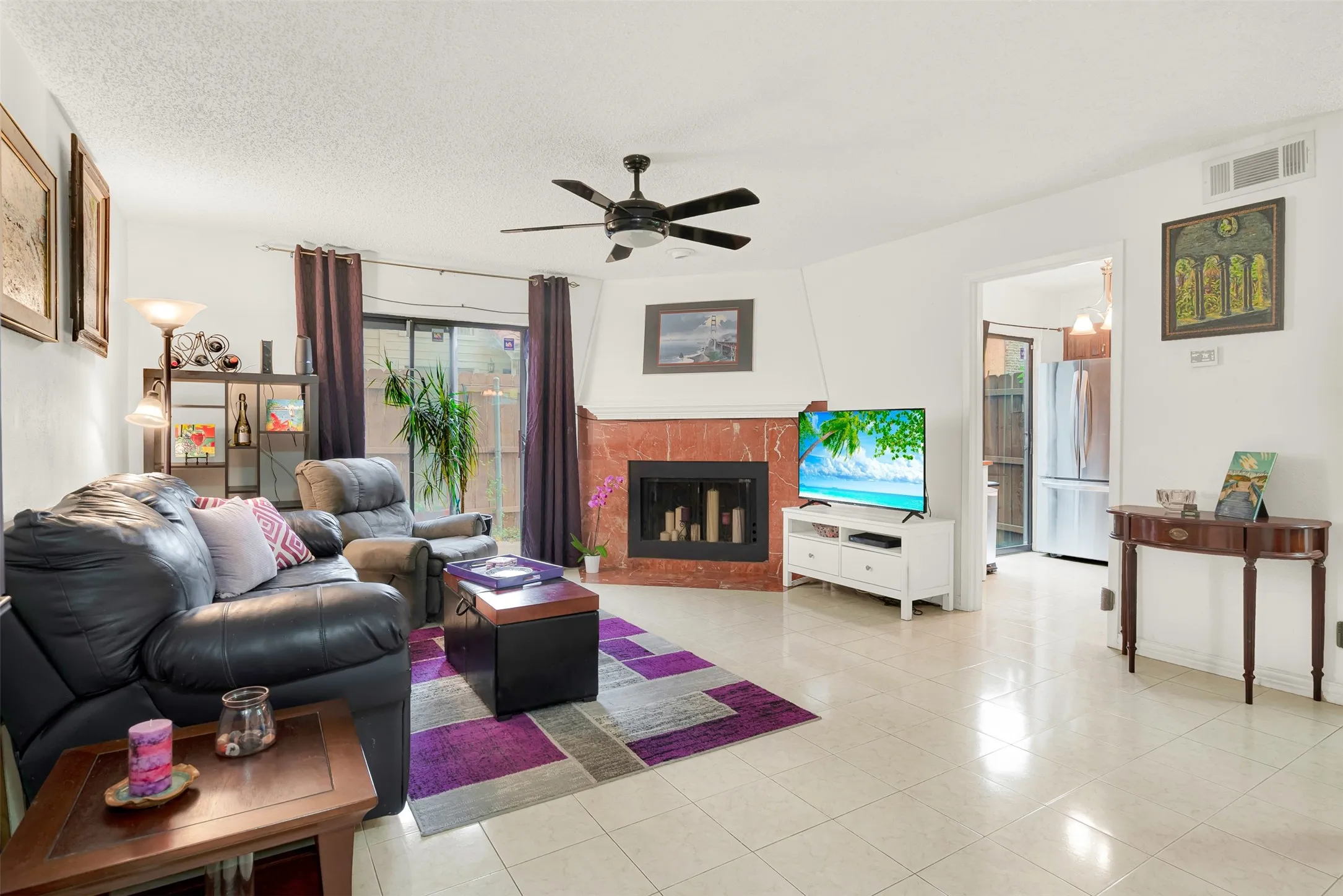 Living area featuring light-colored tile flooring