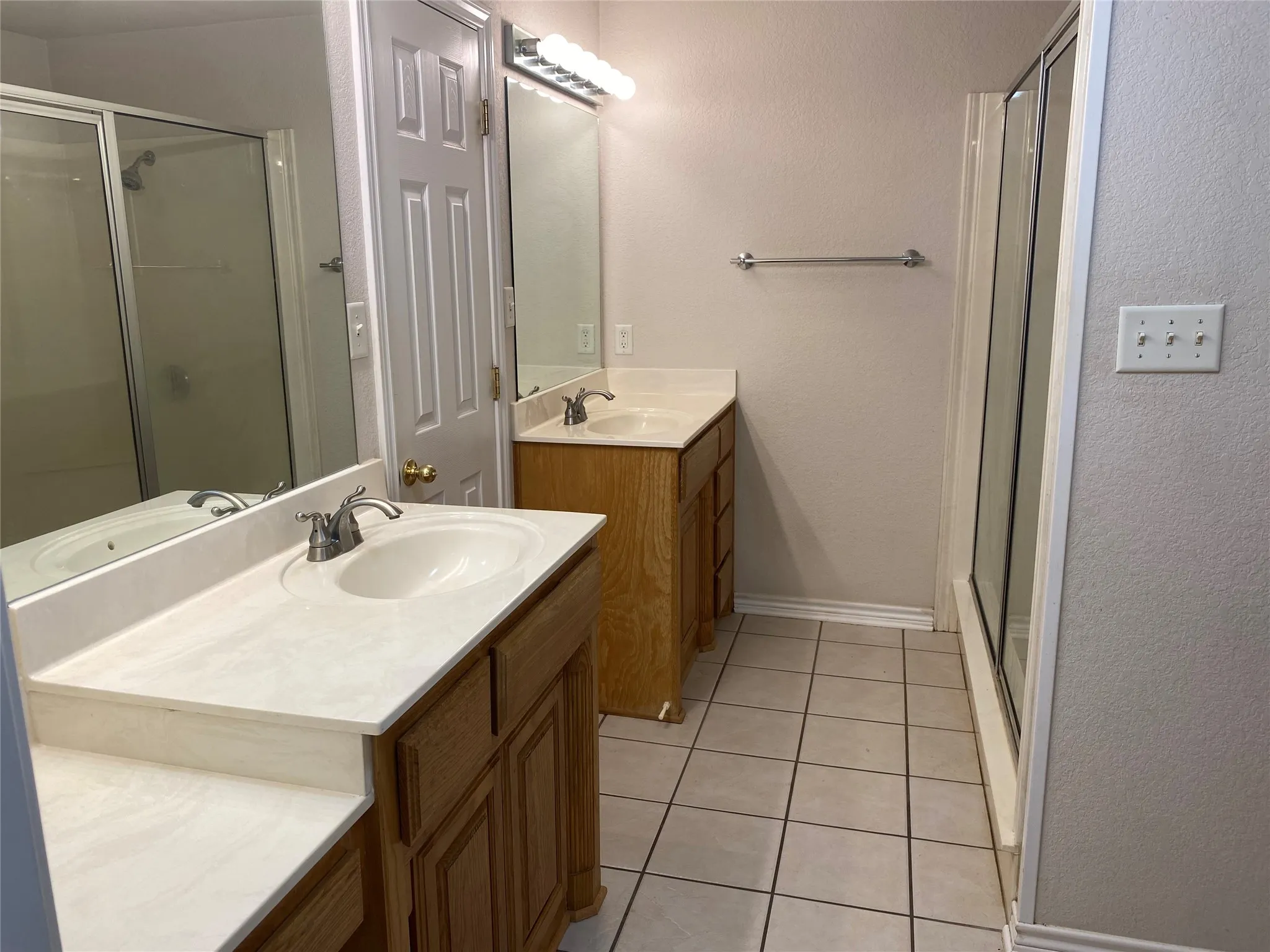 Primary Bathroom with separate vanities.