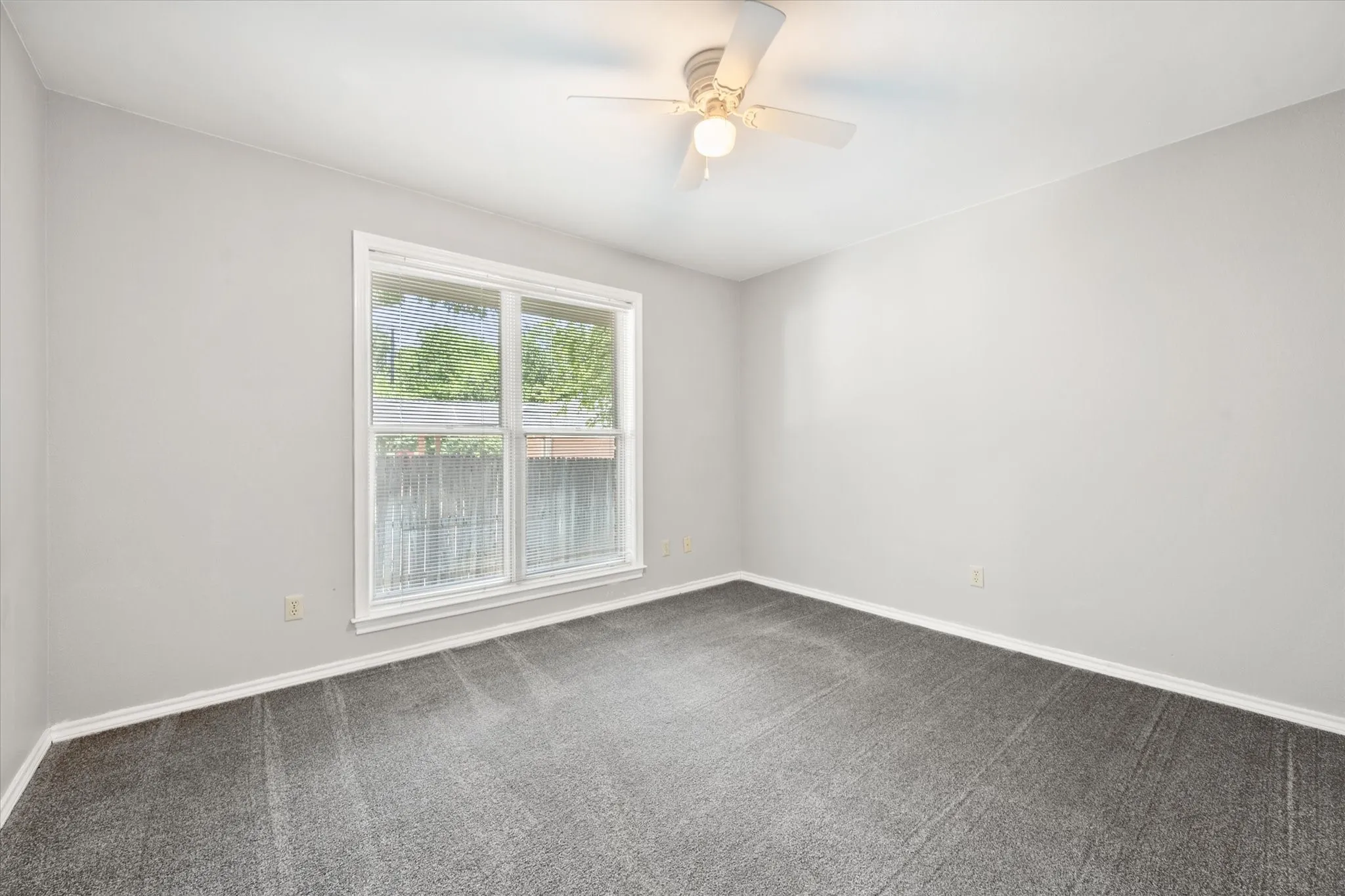 Secondary bedroom on the first level split from the primary bedroom