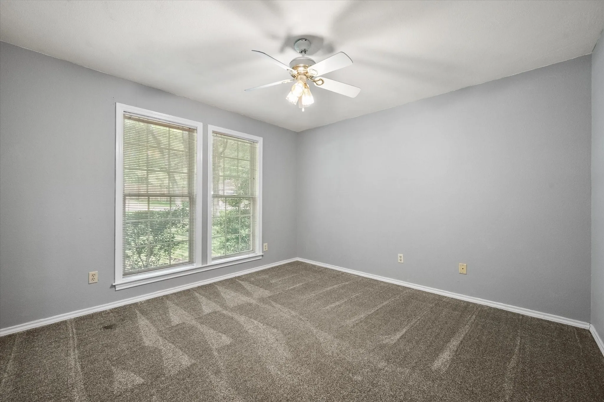 Secondary bedroom on the first level split from the primary bedroom