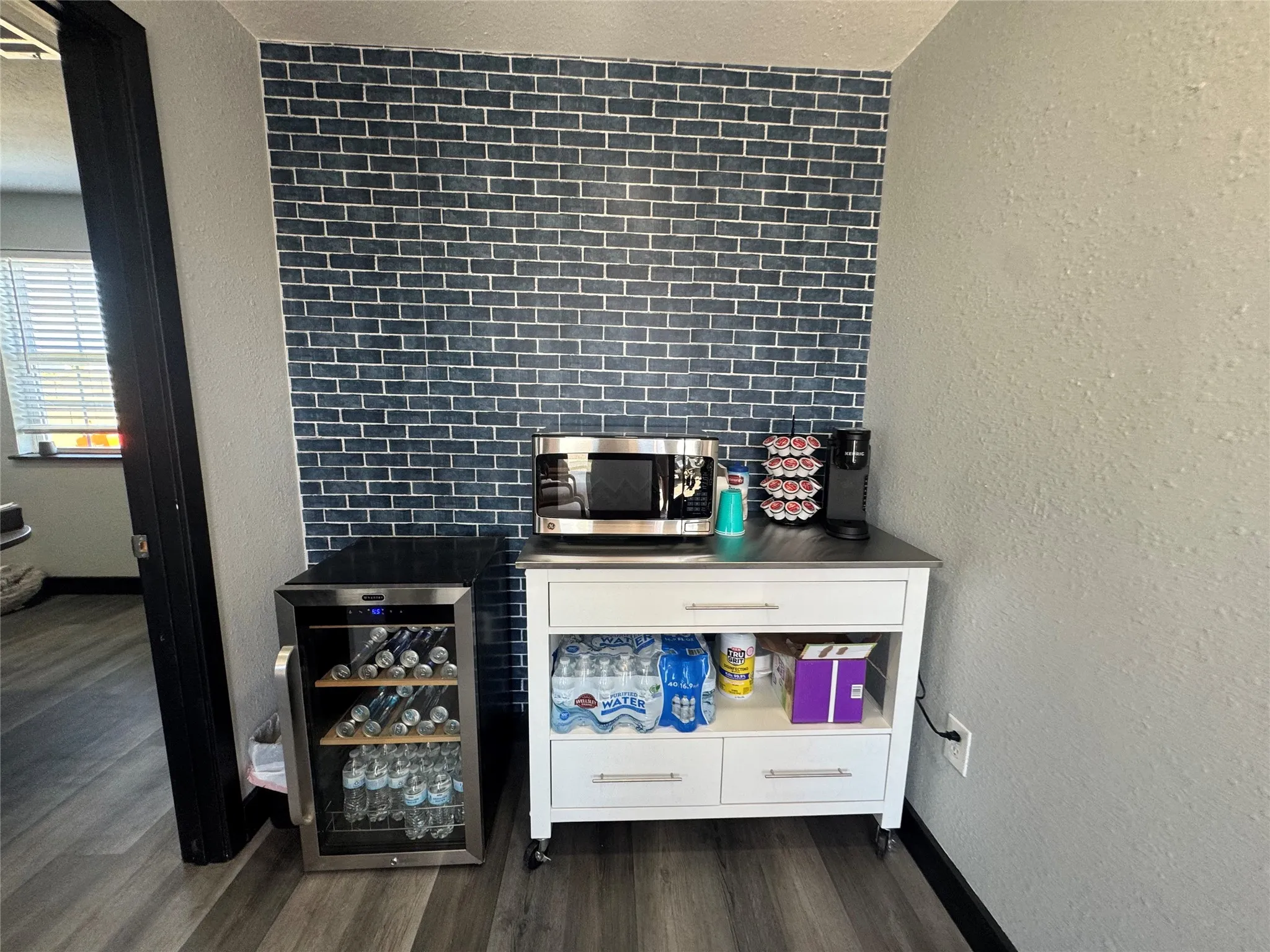 Accent wall featuring blue subway tile
