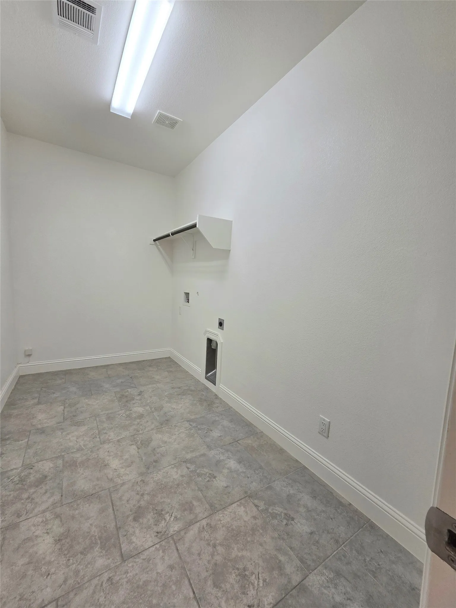 large laundry area, room for a freezer