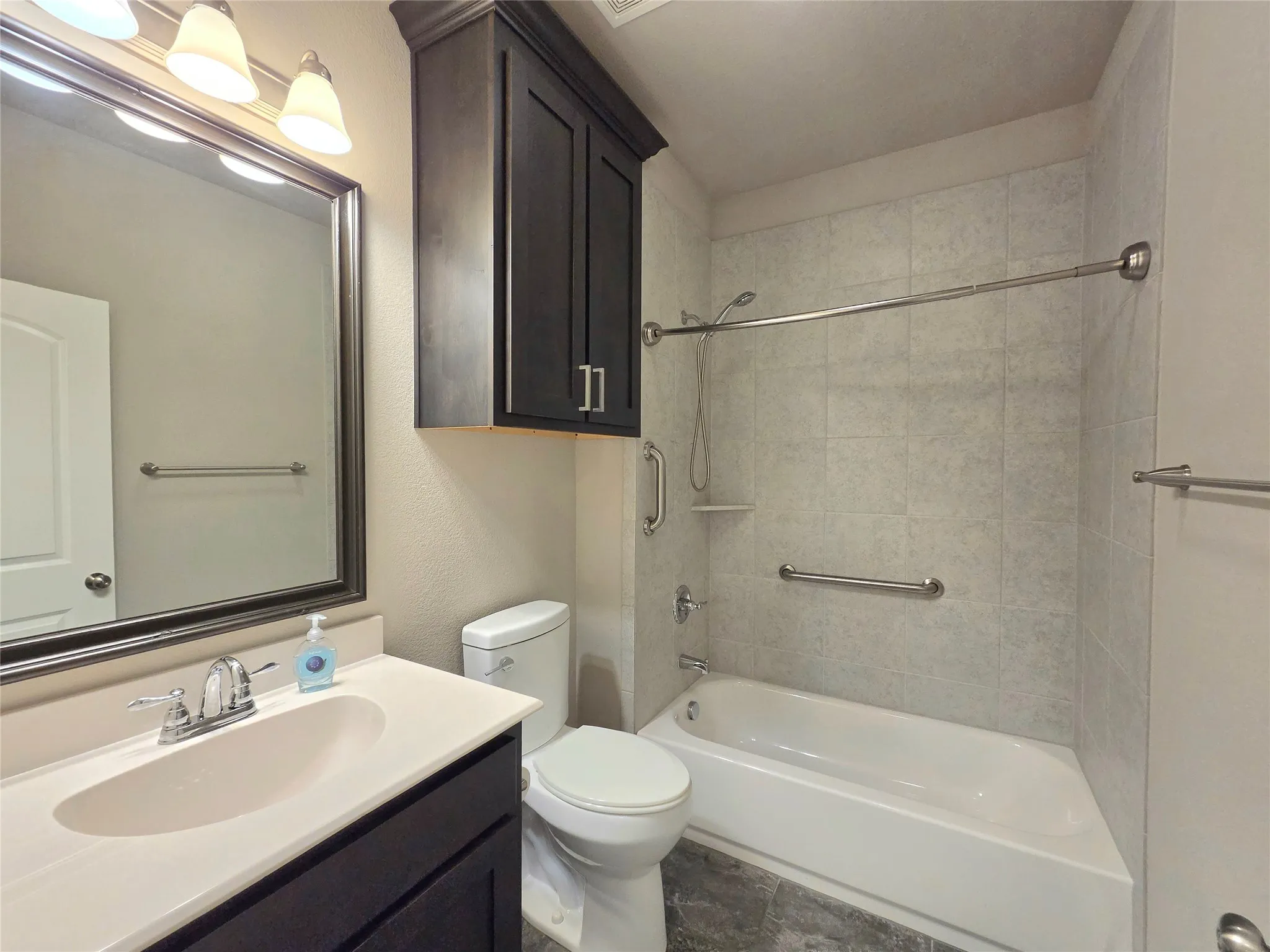 full bath located on first floor, next to front bedroom and office