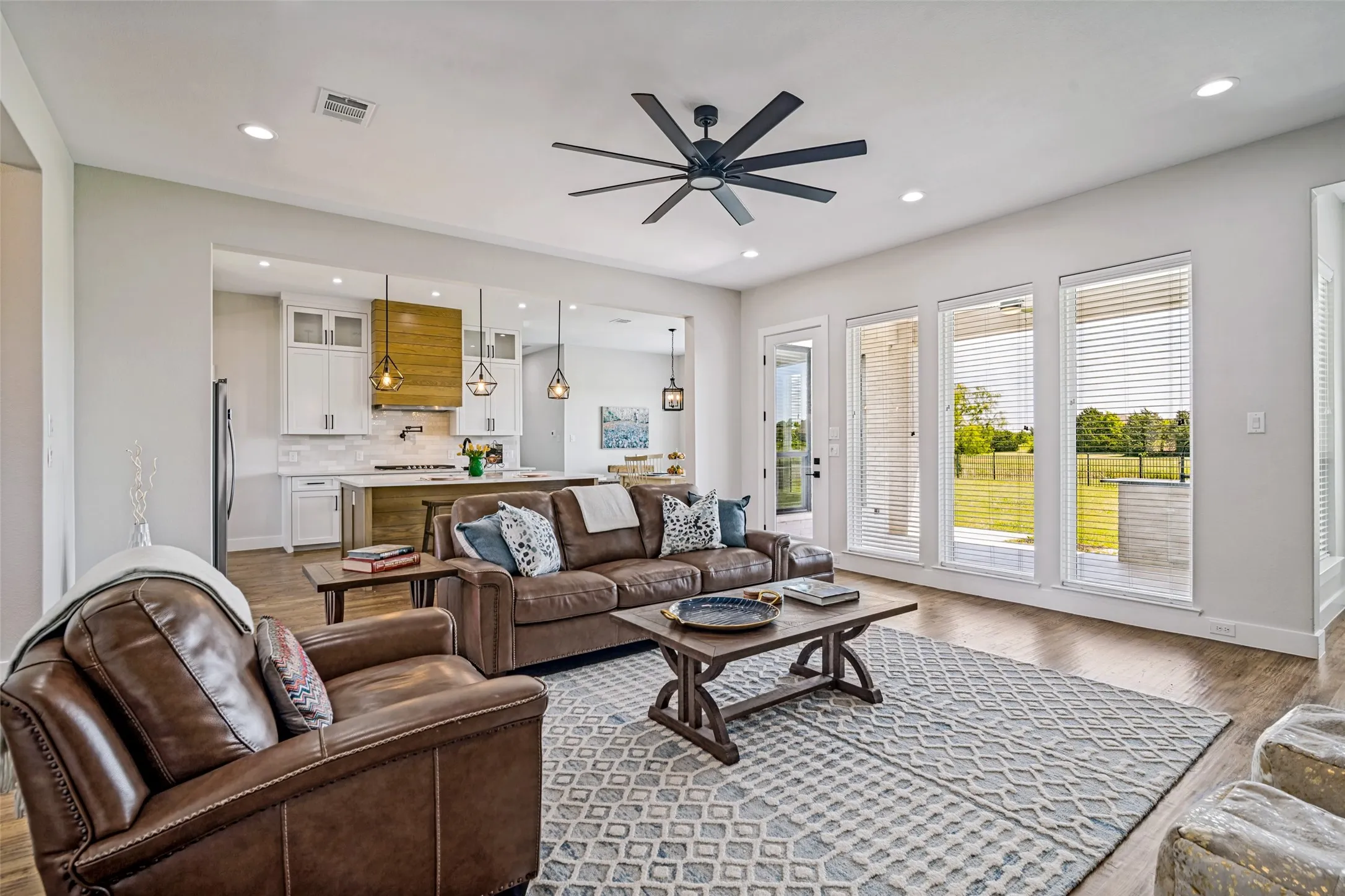 Spacious family room open to kitchen and outdoor covered patio with built in grilling area.