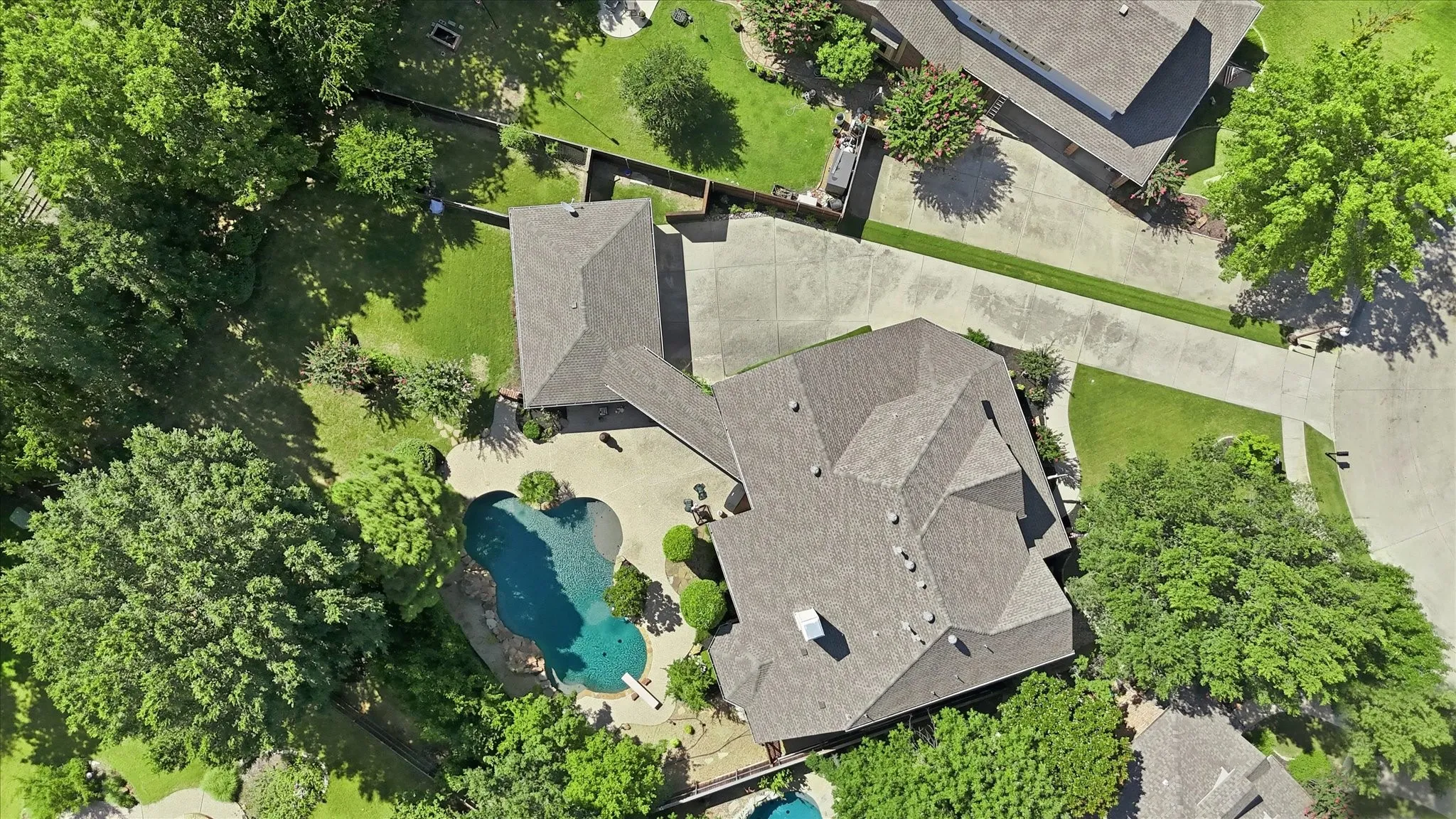 Aerial perspective showcasing the property and its exterior with community mature tree coverage