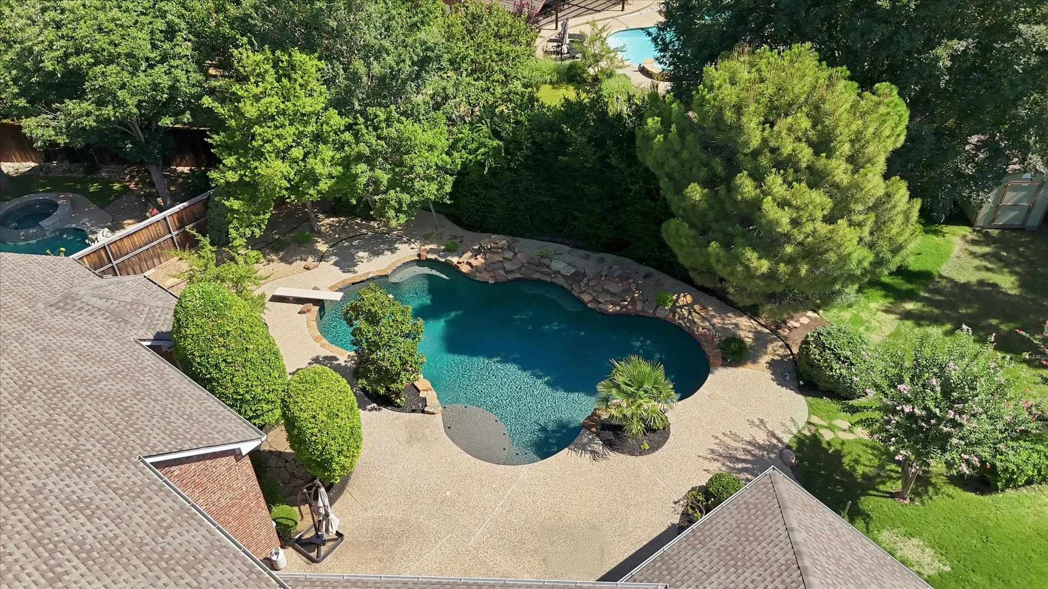 Aerial perspective showcasing the property and its pool