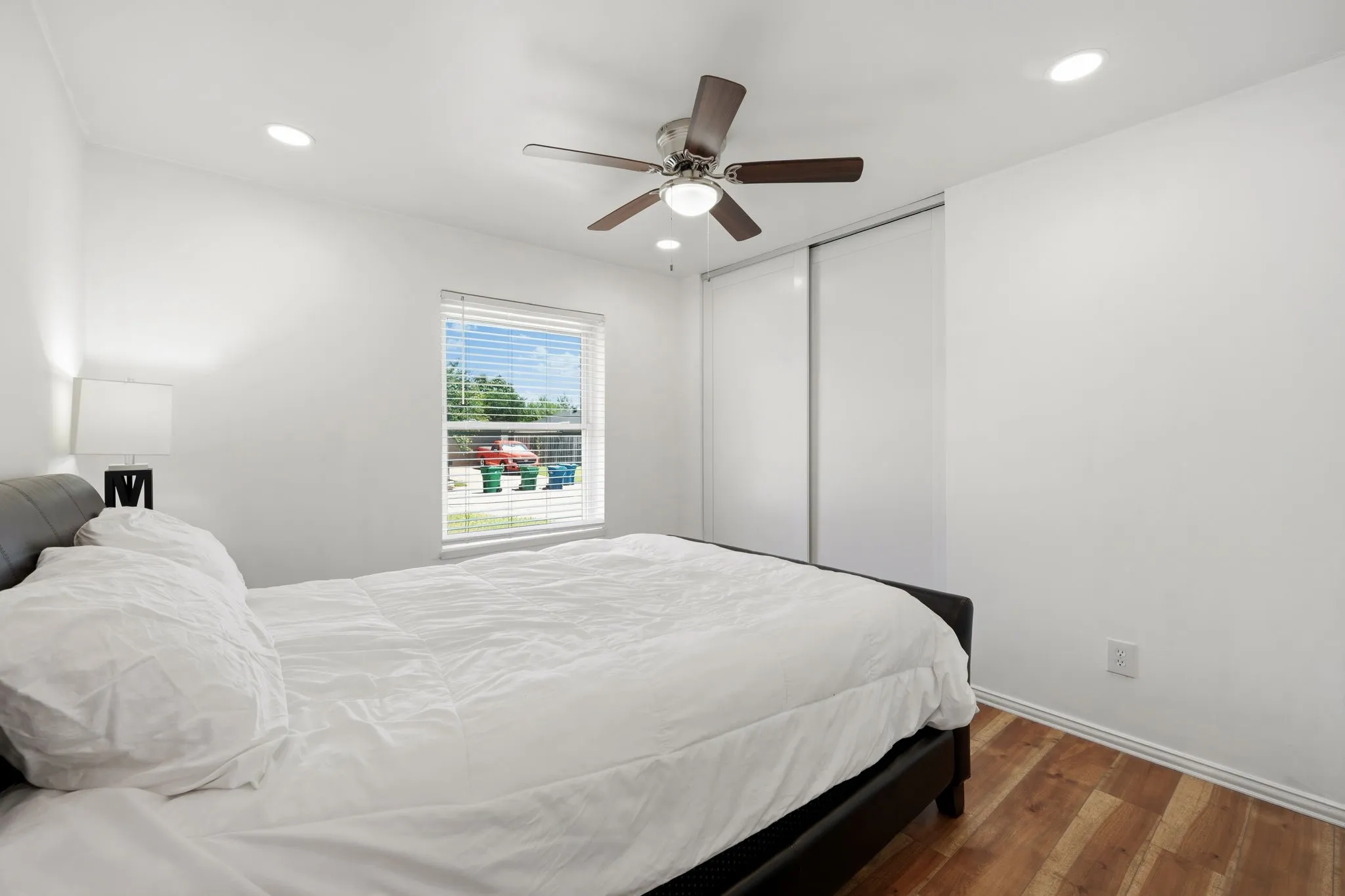 Bedroom featuring wood-finish flooring, recessed lighting, and a ceiling fan