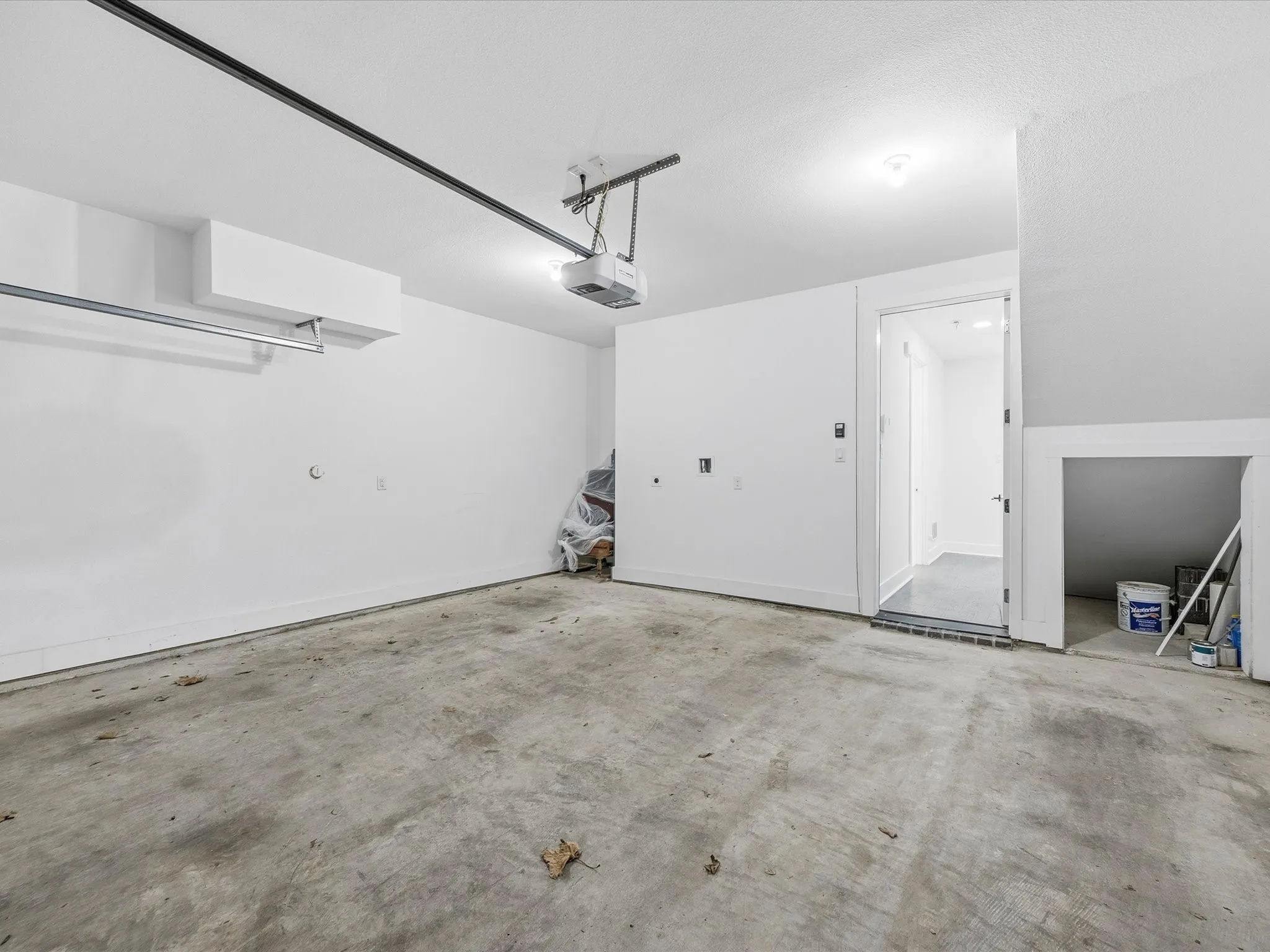 Garage featuring a garage door opener