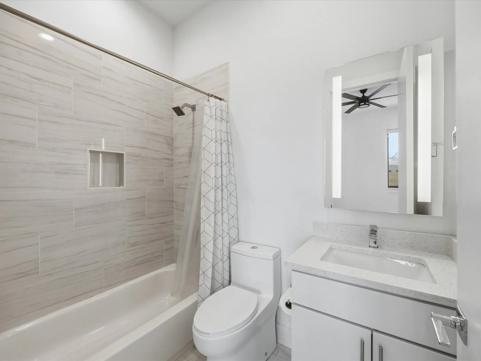 Bathroom featuring vanity and shower / bath combo