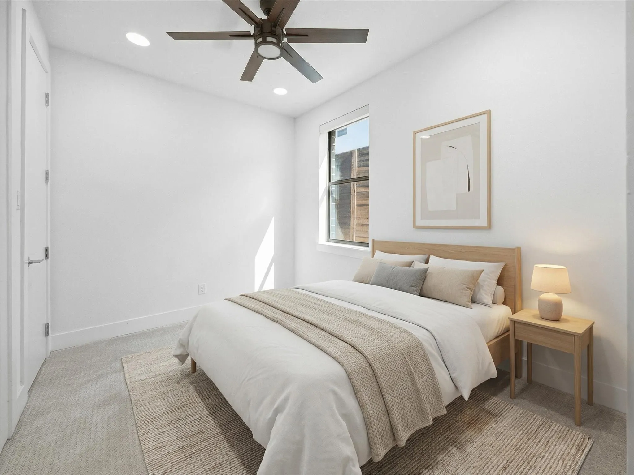 Bedroom with light carpet, a ceiling fan, and recessed lighting