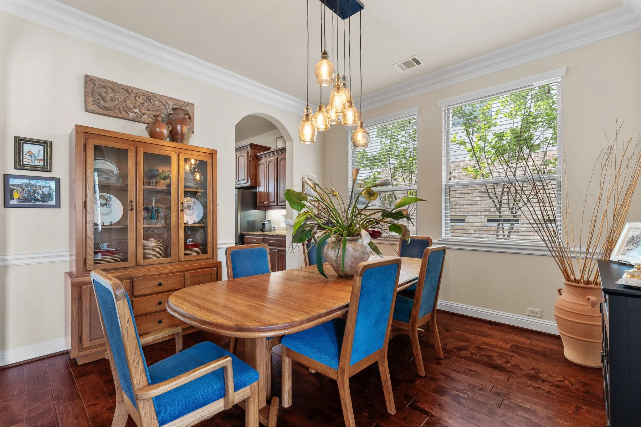 Formal dining with hardwood flooring, updated lighting is full of natural light.