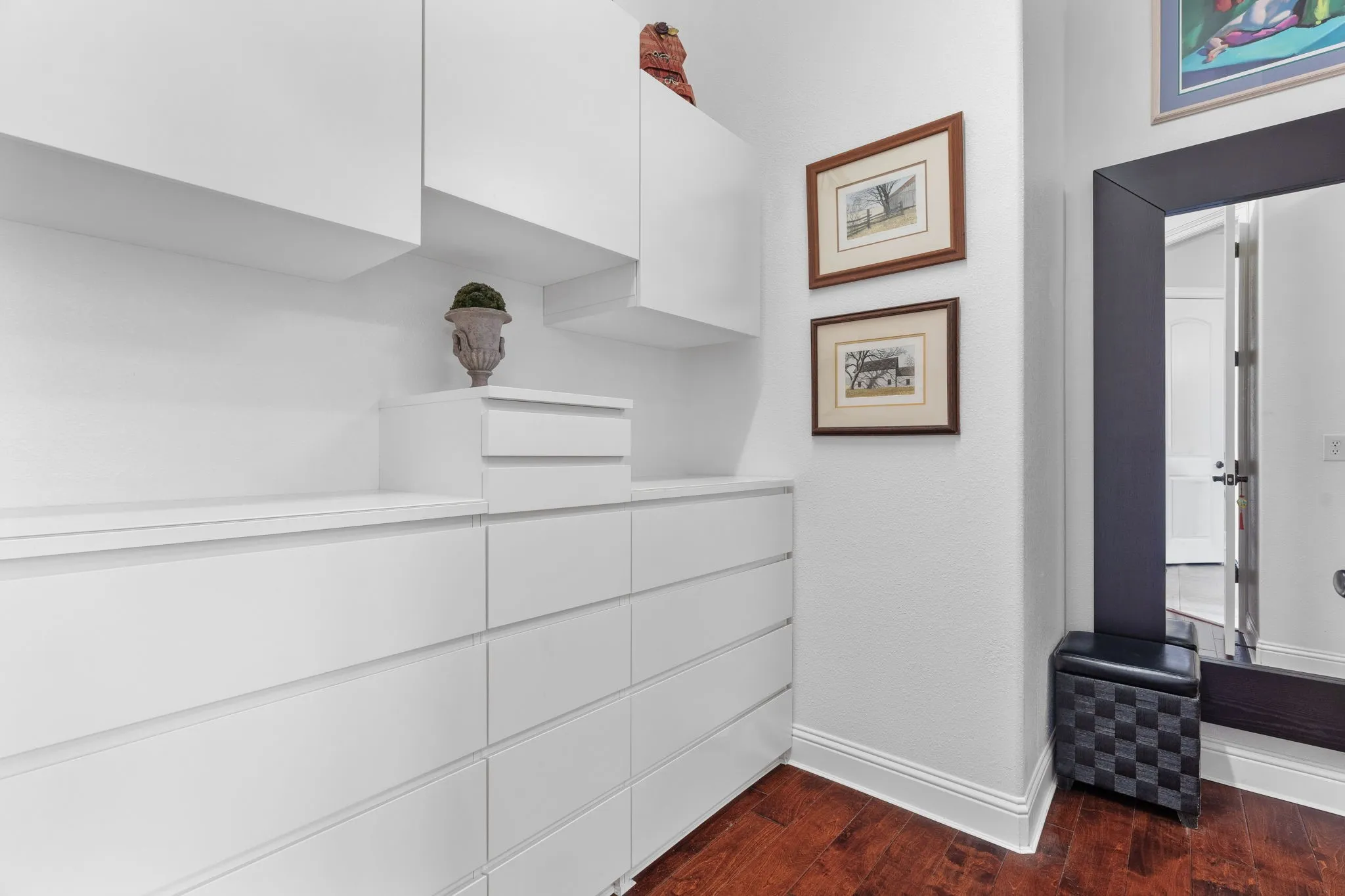 Part of the primary closet pictured. it winds around with more customization and is spacious.