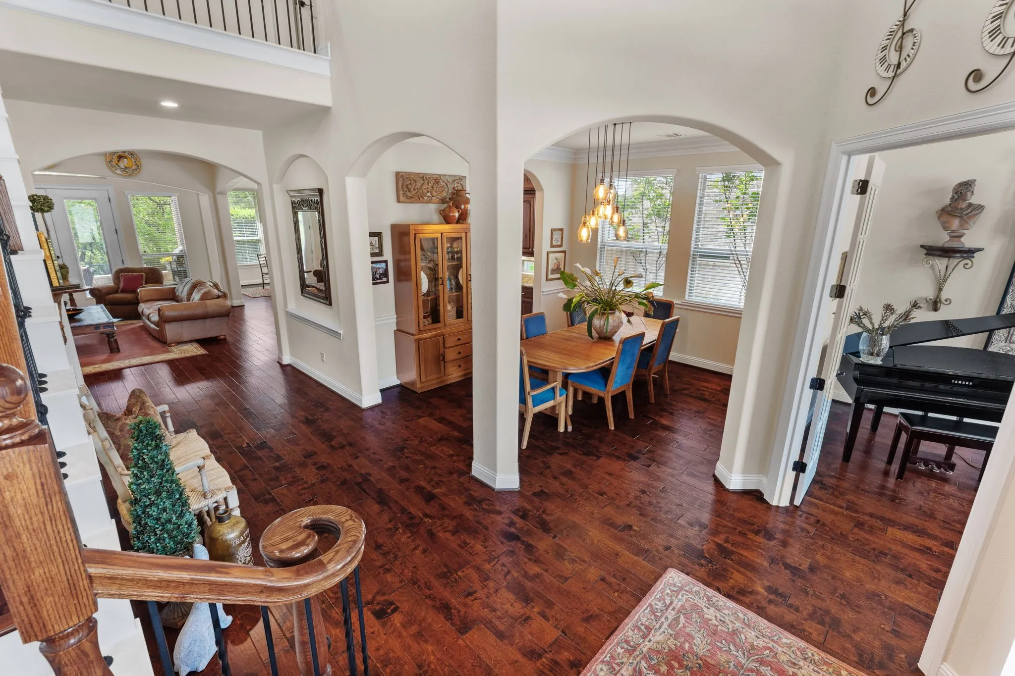 French doors open to the office, being used as a sitting room, formal dining with updated lighting.