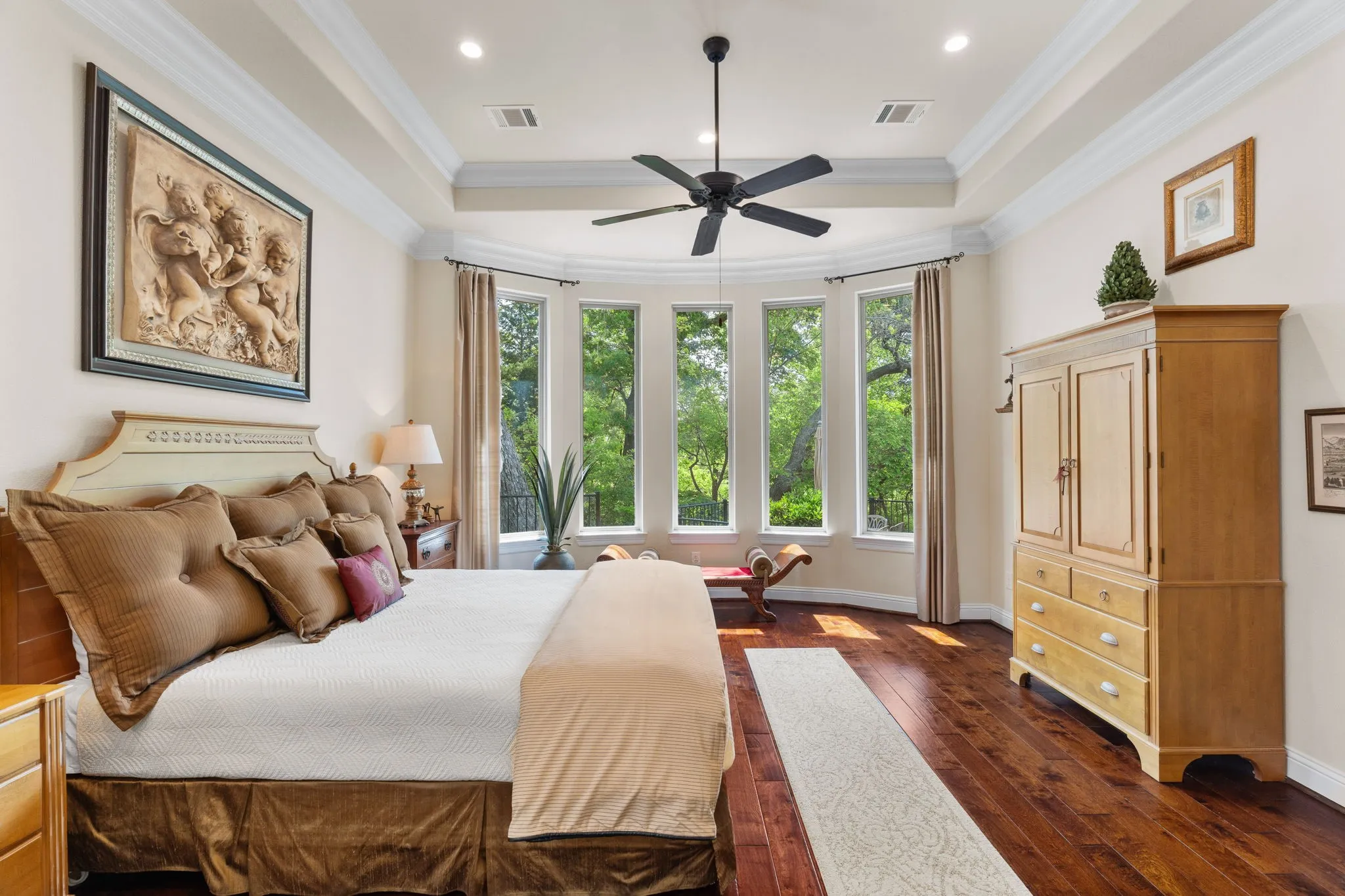 Love this primary bedroom suite. A Room with a View! Blinds available for the windows.
