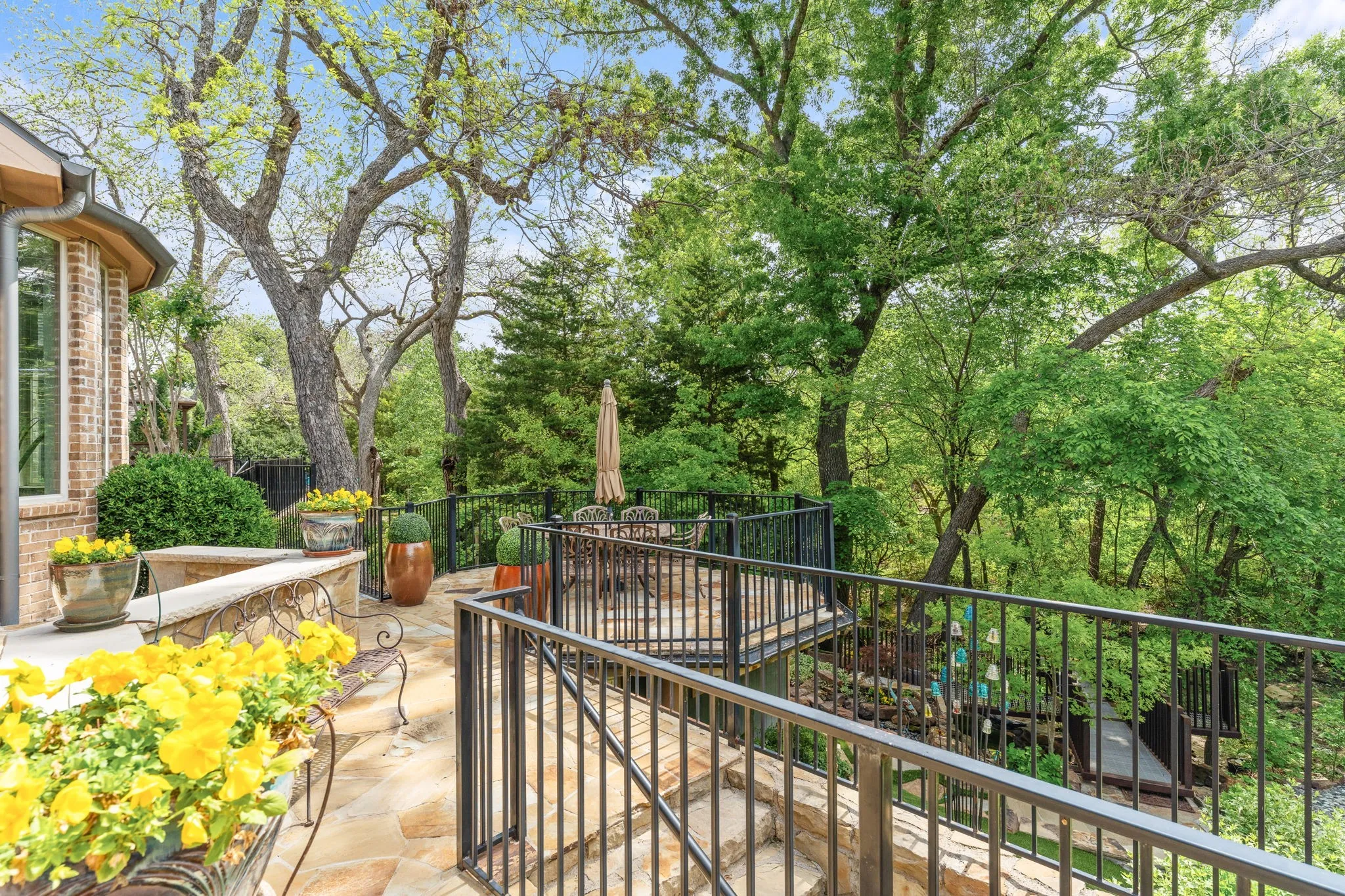 Backyard is a Sanctuary, so many places to sit, and enjoy the canopy of trees and lush greenery.