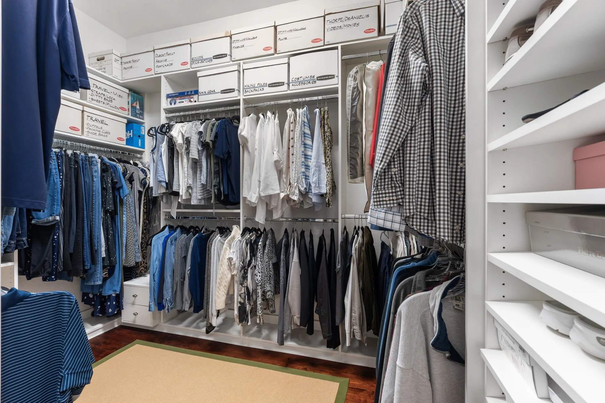 Primary closet  with custom built ins