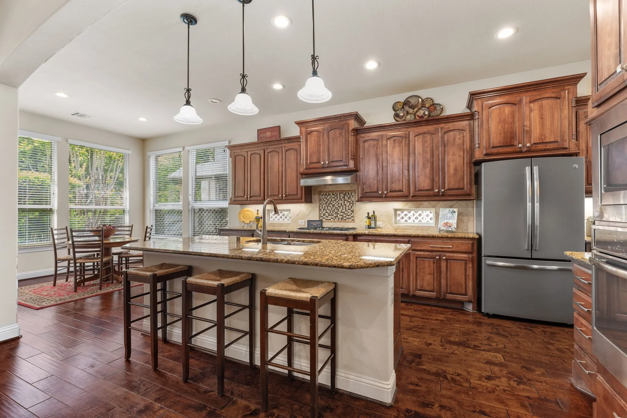 Large island with pull out trash drawer. Pantry is not pictured, but wanted to mention it as it is large and across from the butlers pantry.