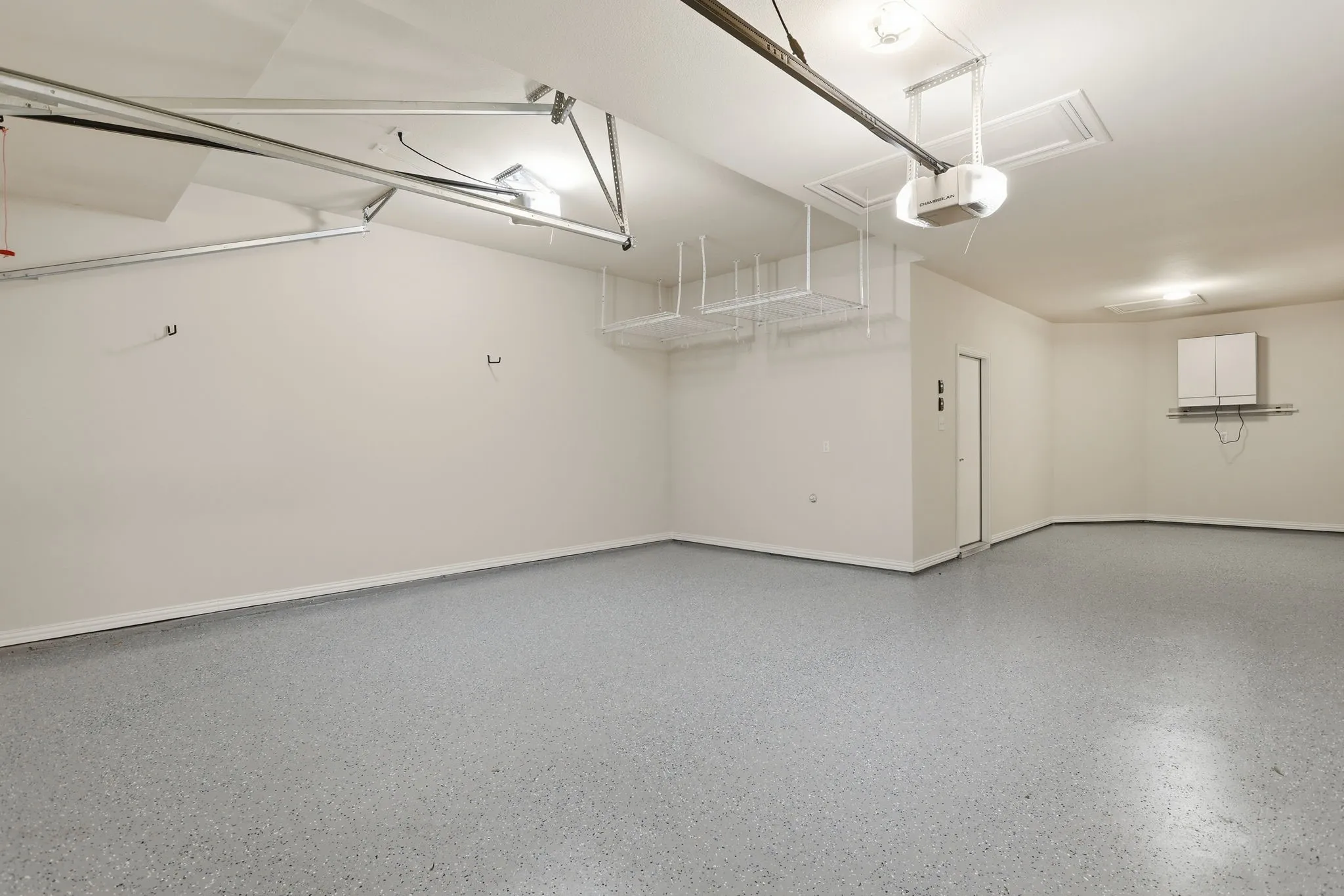 brand new epoxied floor in 3 car tandem garage