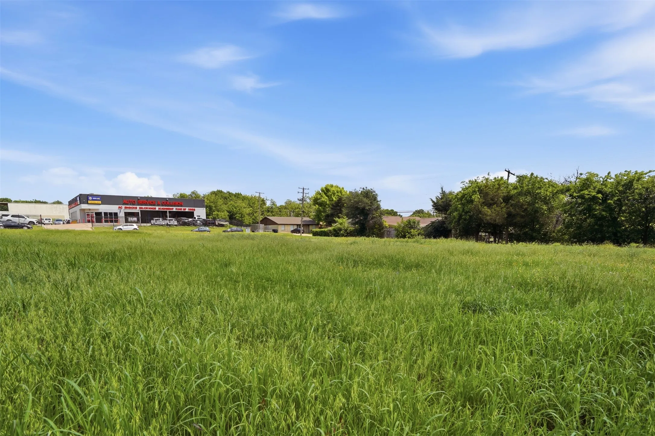 Expansive green space featuring natural grass and clear skies