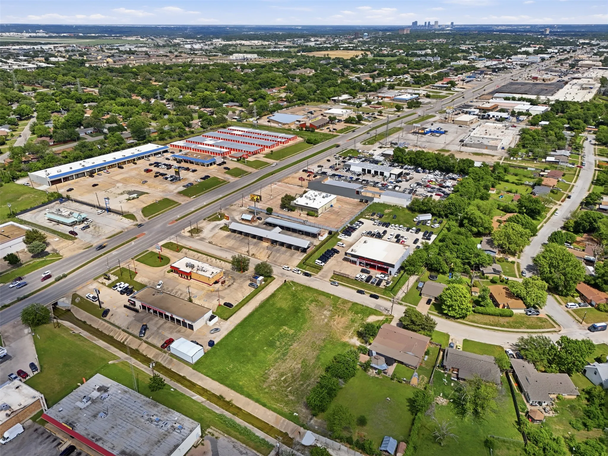 Expansive aerial perspective showcasing a commercial corridor with multiple retail centers