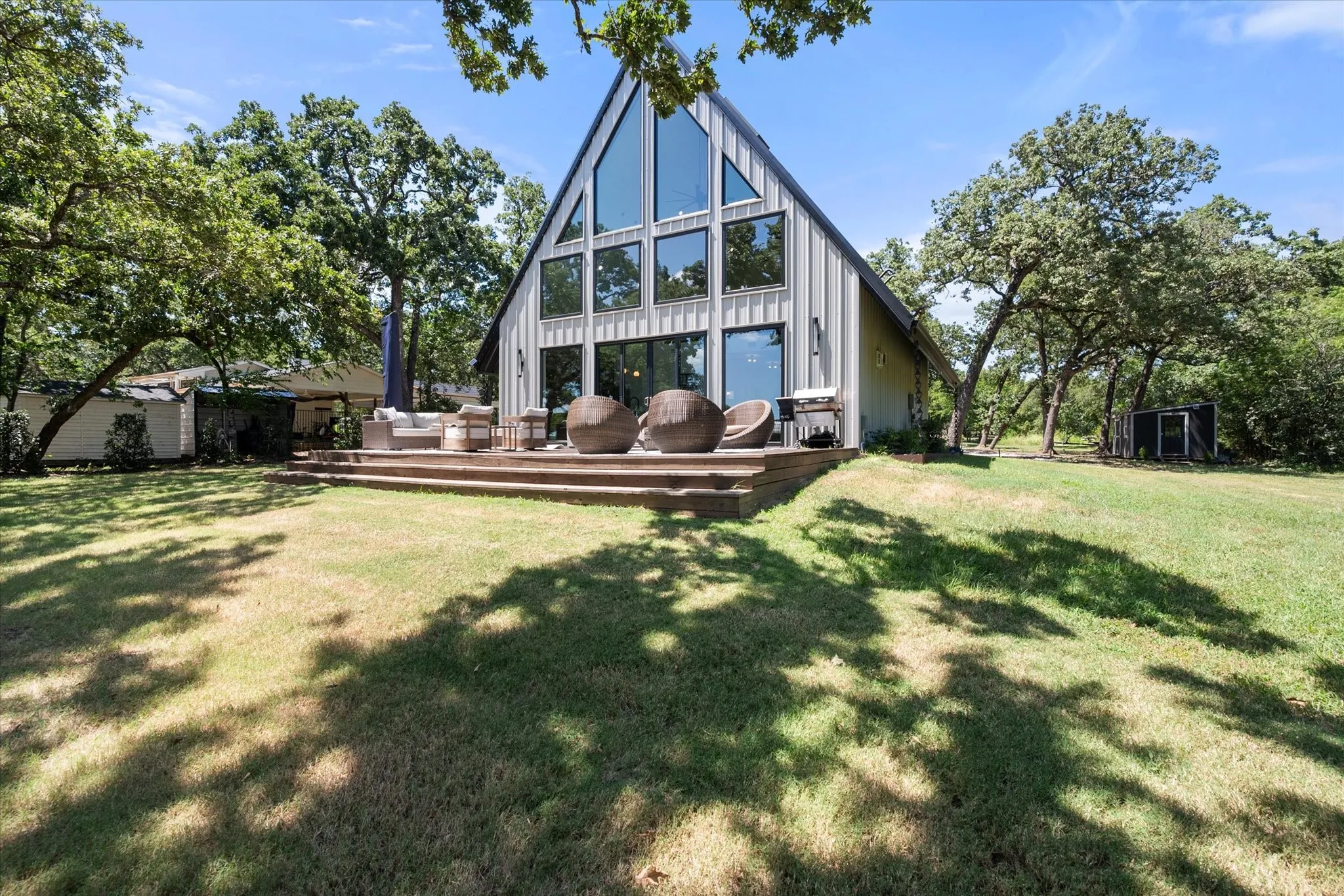 Expansive backyard creates the perfect setting for outdoor entertaining and lakeside games.