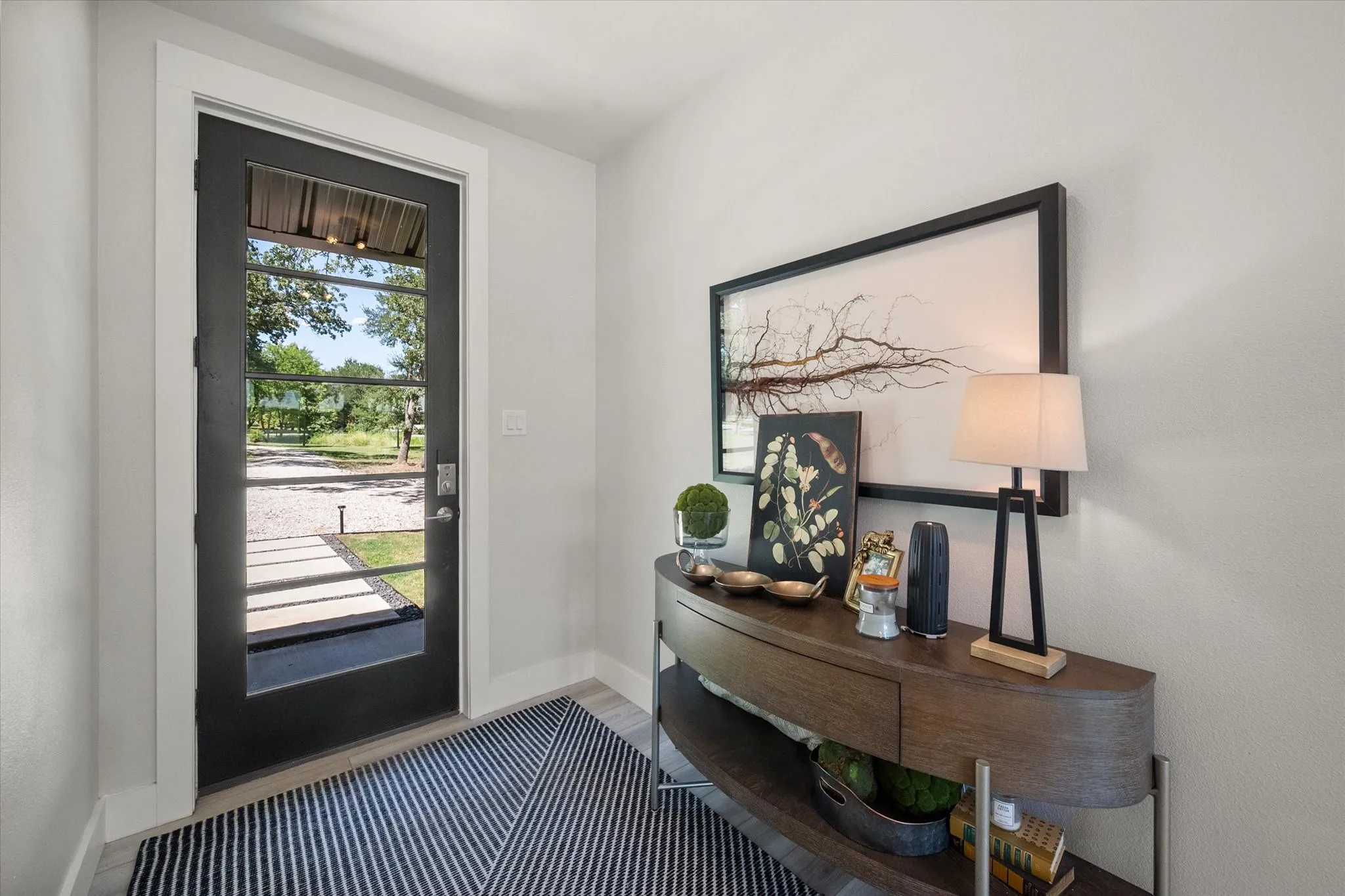 Welcoming entry introduces the clean modern style found throughout this custom lake home.
