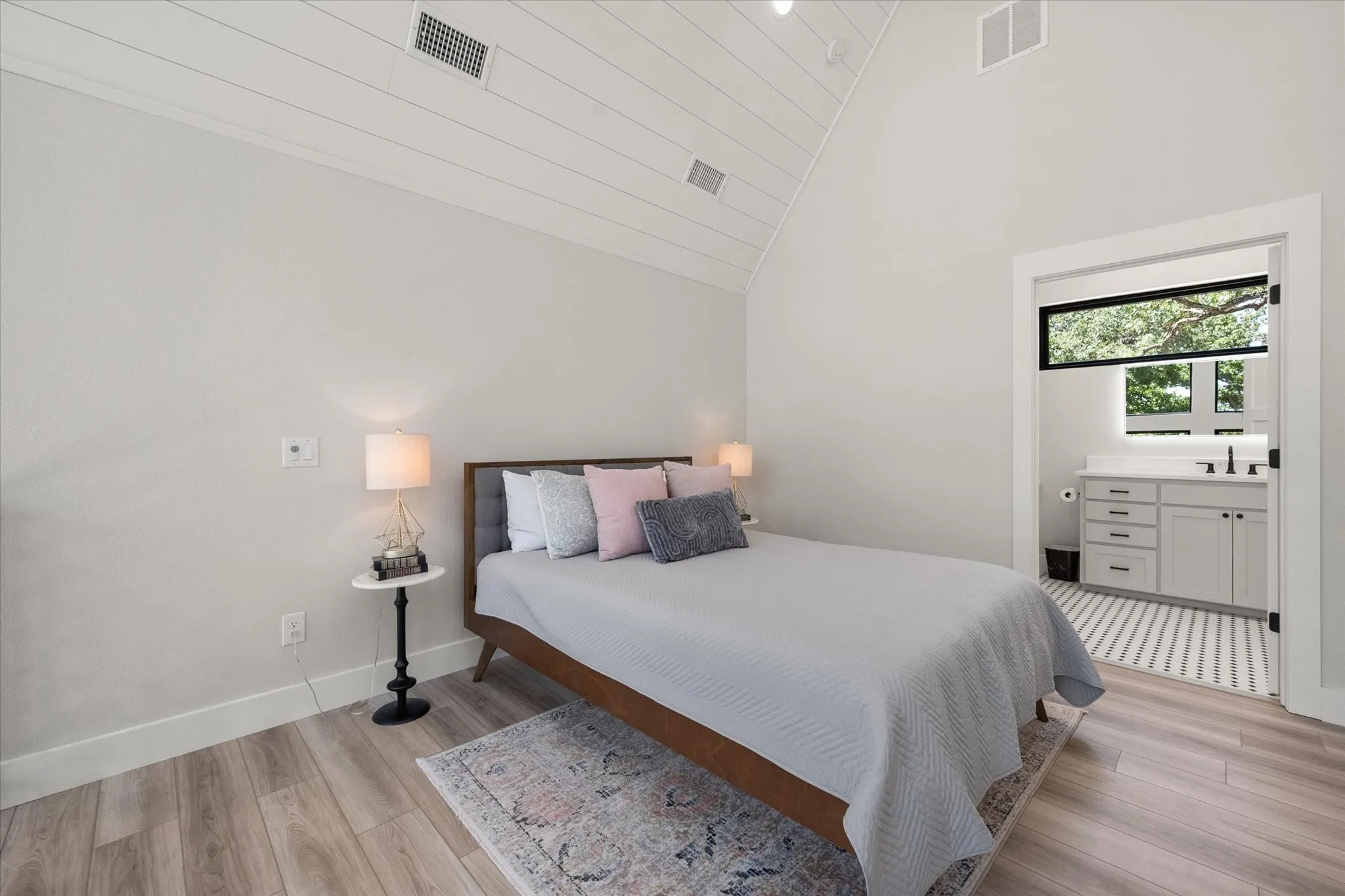 Primary suite combines privacy with breathtaking views through the wall of windows.
