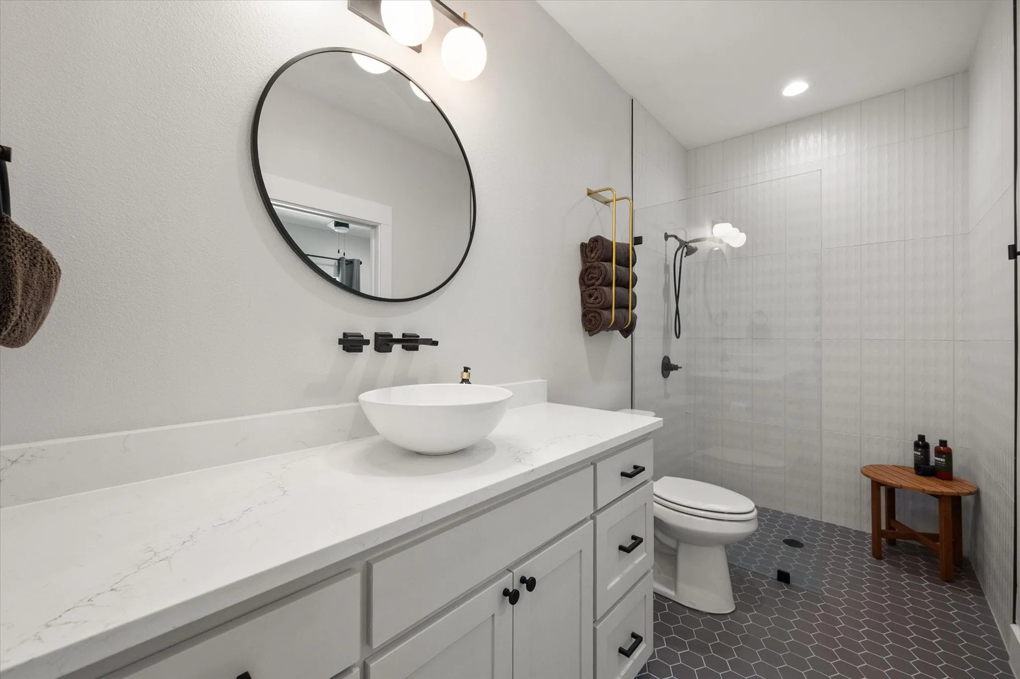Stylish guest bathroom offers clean contemporary design with quality finishes.