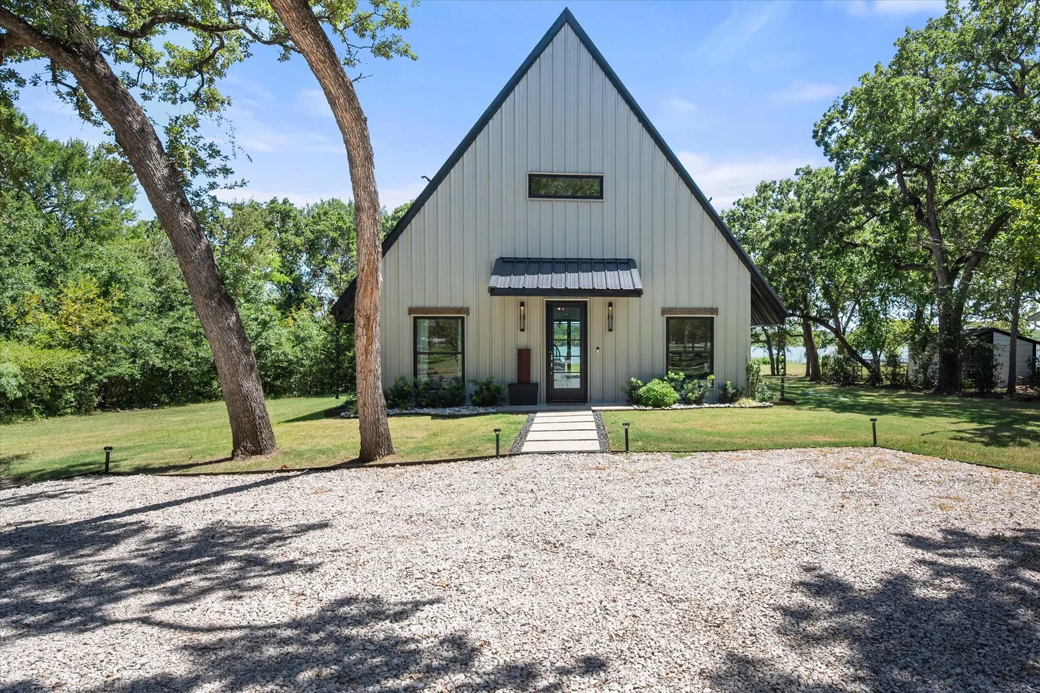 Gravel drive provides plenty of parking for guests and weekend visitors.