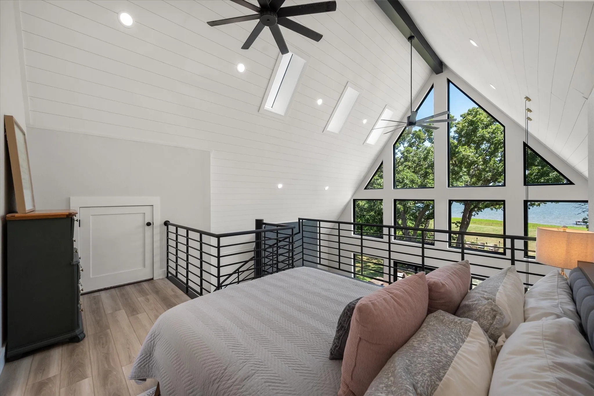 Wake up to peaceful lake views from the private primary suite loft.