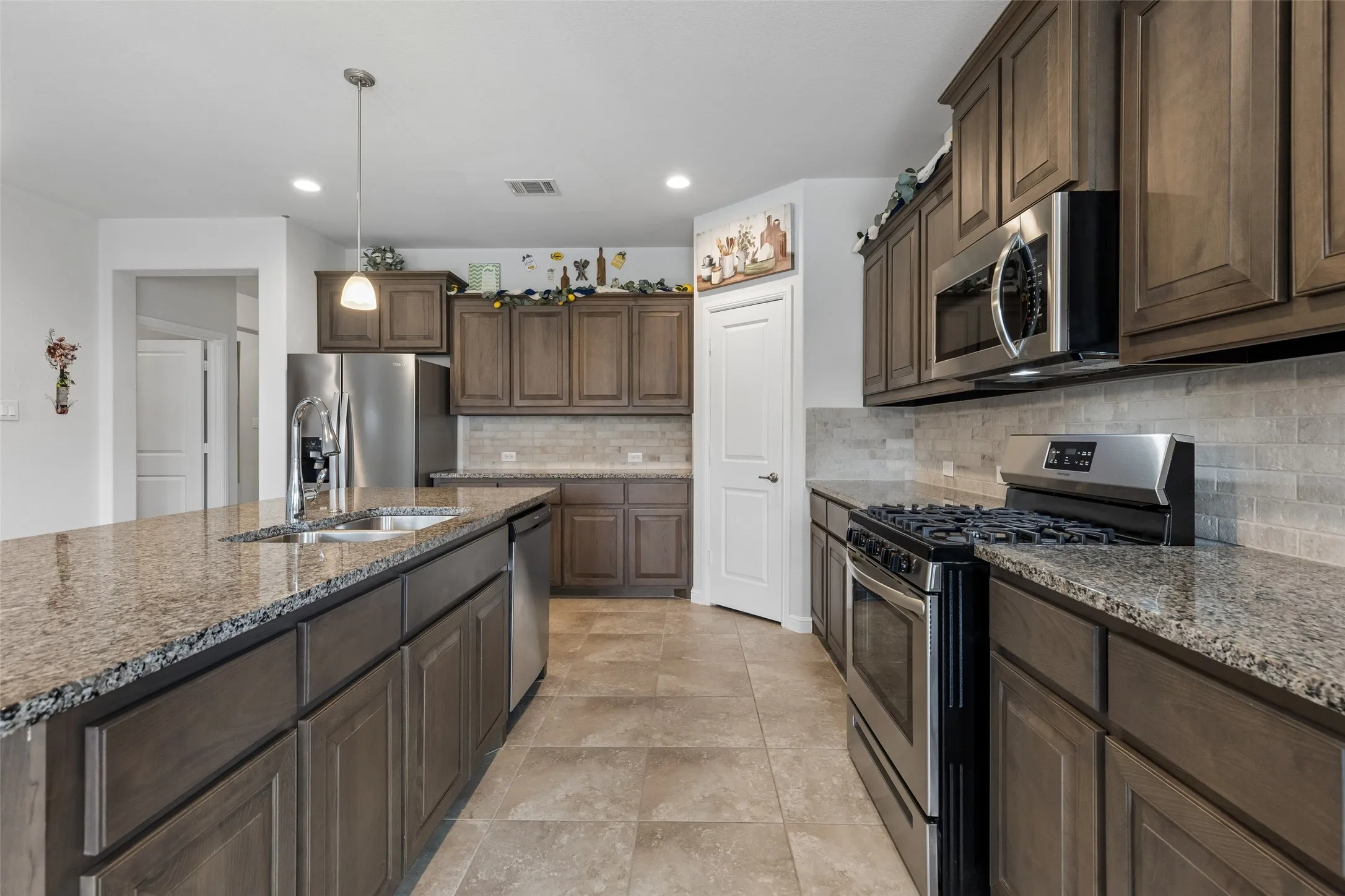 Ample cabinetry and walk in pantry.