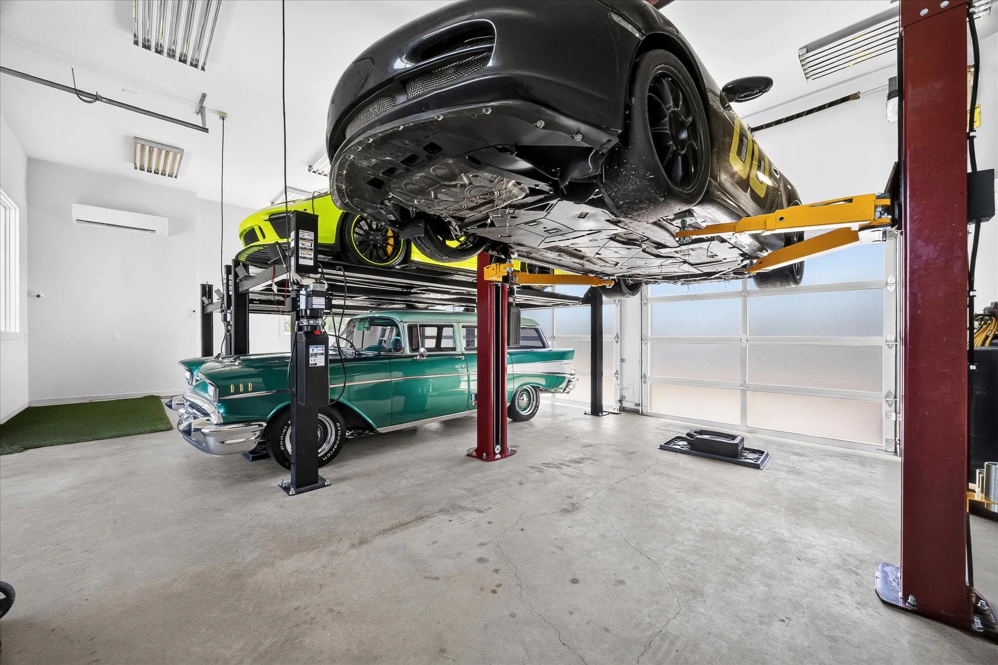 Back 3 oversized 3 car garage with 3 auto lifts