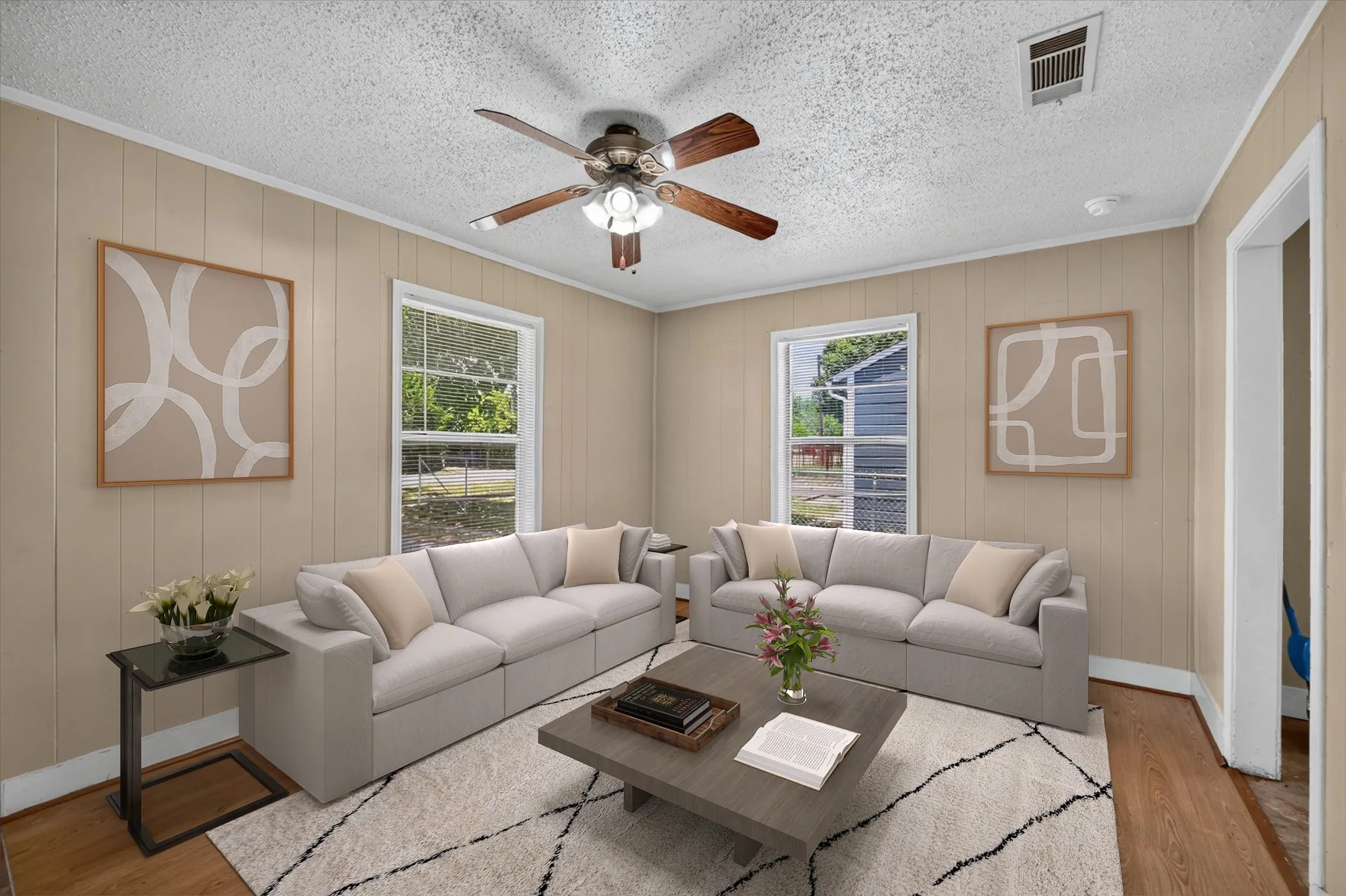 Living space with neutral-toned vertical paneling and white trim
