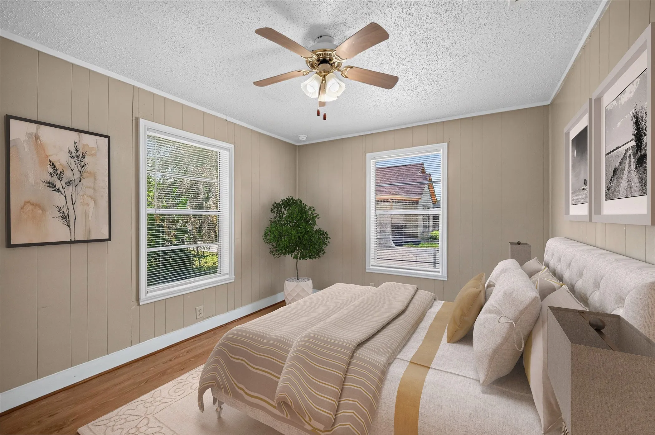 Room featuring wood-finish flooring, vertical paneling, and white trim