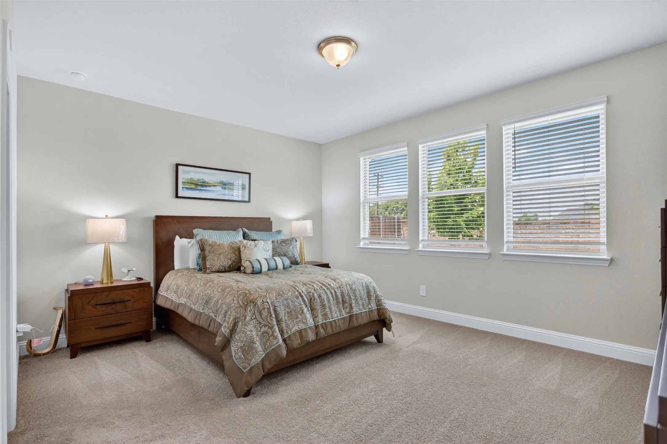 Spacious room featuring neutral carpeting and light-toned walls