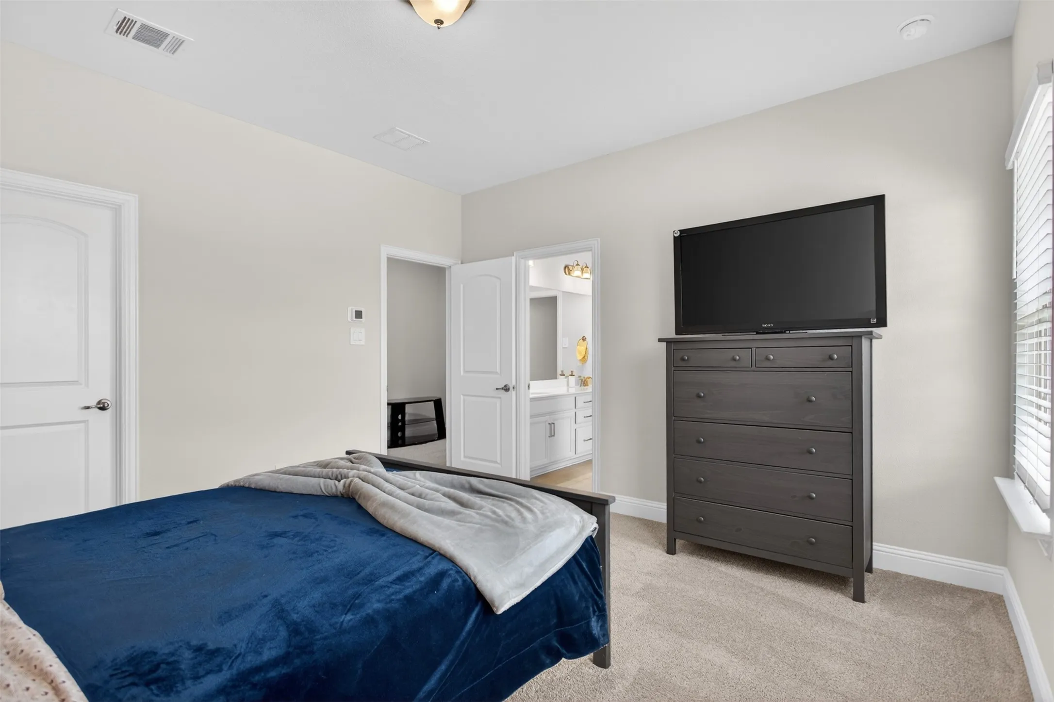 Neutral tone walls with carpet flooring