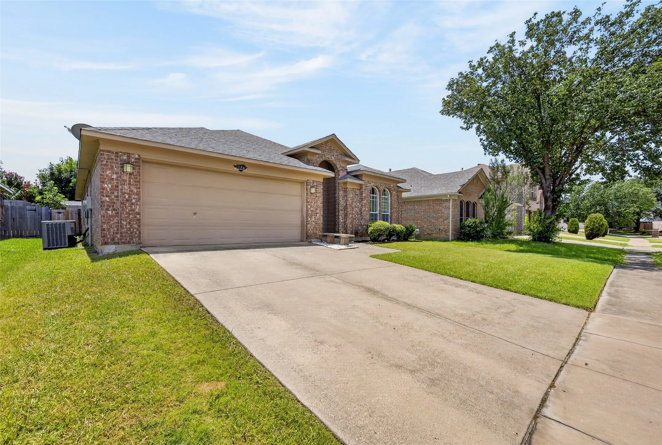 Brick exterior with a two-car garage