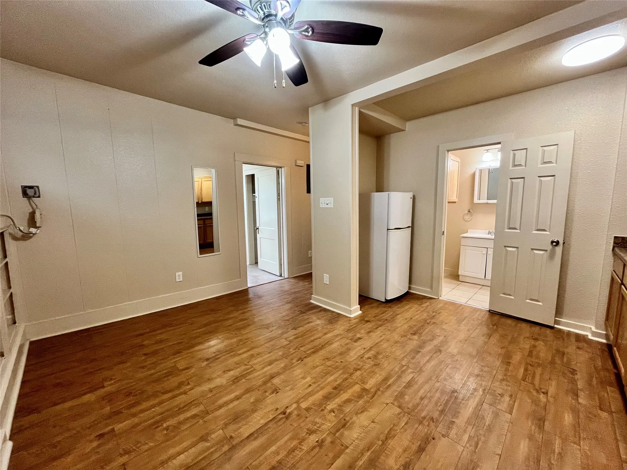 This bright and versatile living area offers beautiful wood-look flooring and a seamless, open flow into the rest of the home. It’s the perfect canvas for your cozy sectional, entertainment setup, or a study nook!