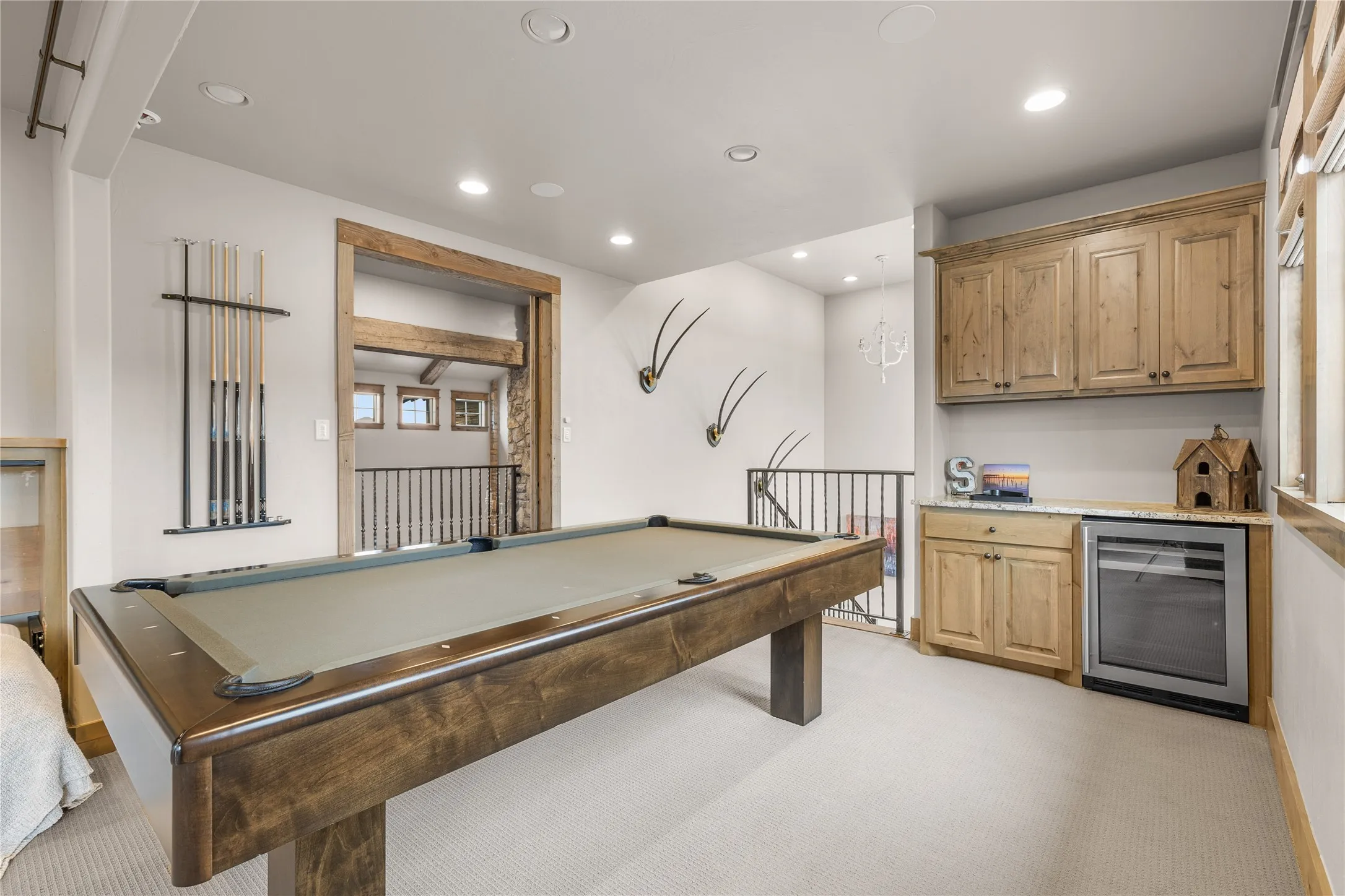 3rd floor game room with bunks, bar and pool table