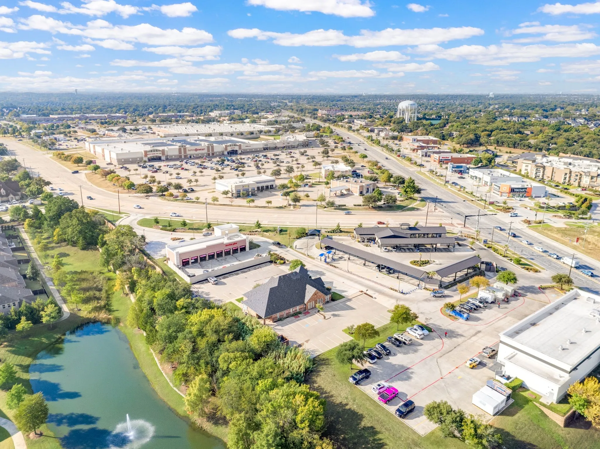 Aerial perspective showcasing a commercial property within a developed area